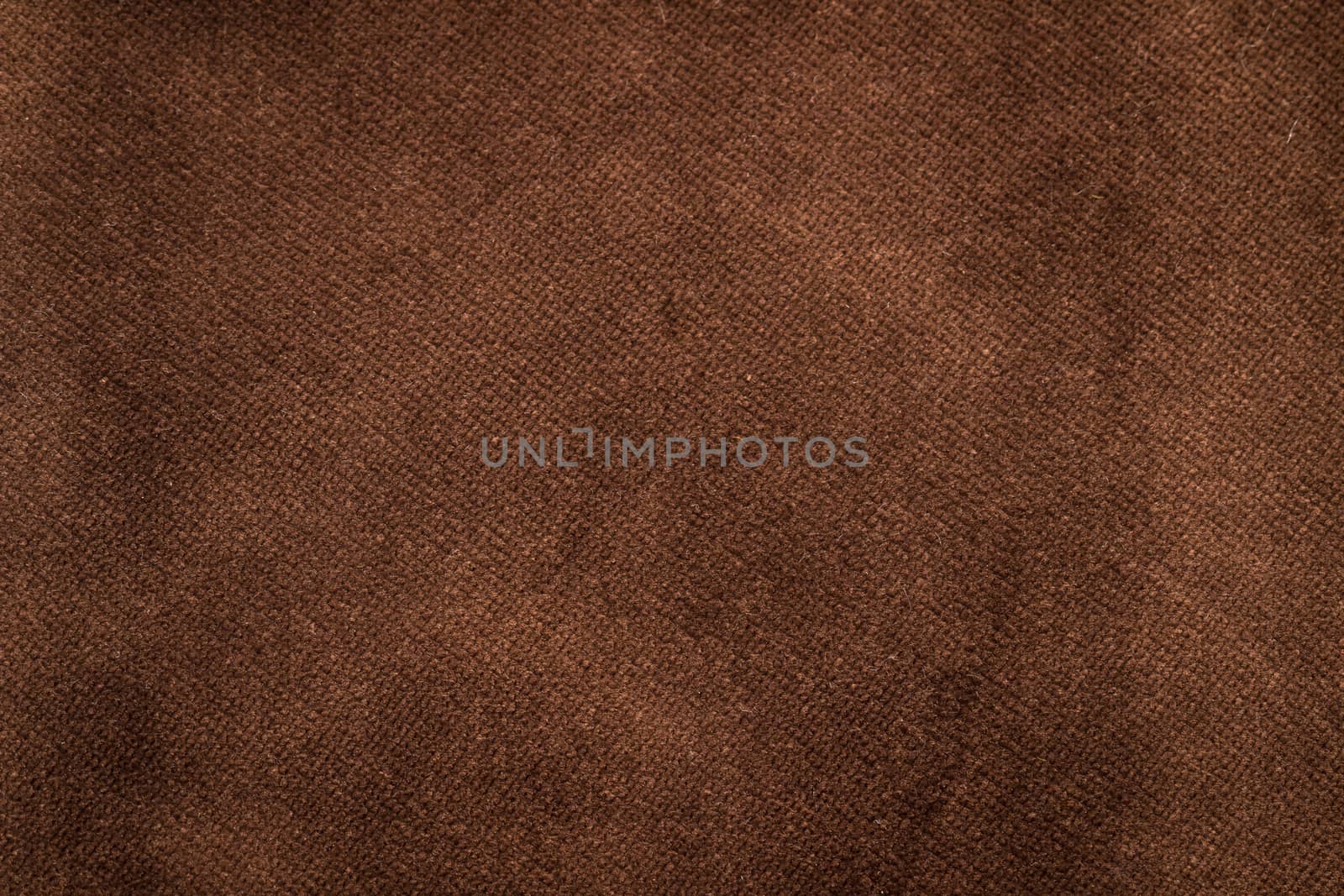 The Velvet fabric texture in brown color.