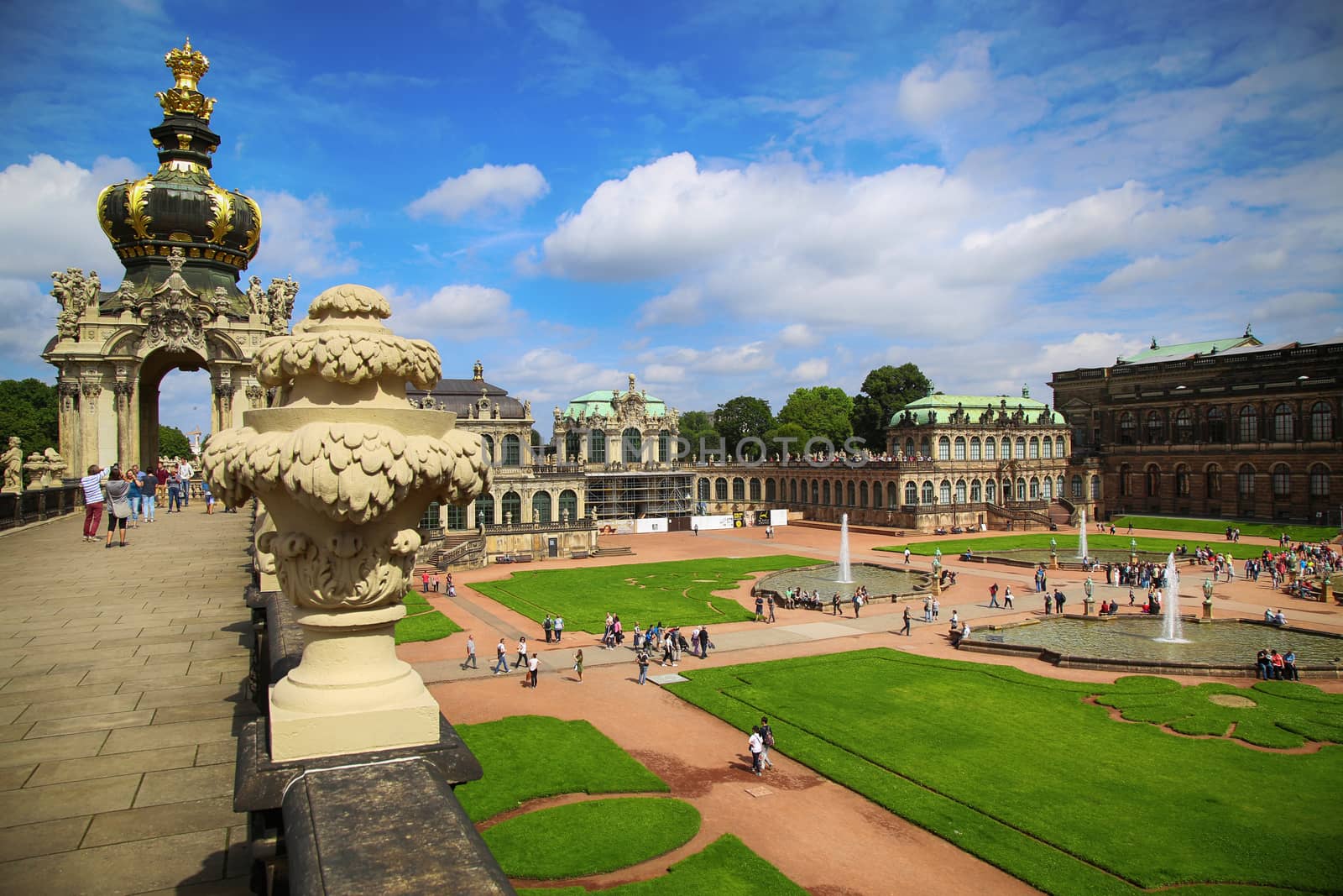DRESDEN, GERMANY – AUGUST 13, 2016: Tourists walk and visit Dresdner Zwinger, rebuilt after the second world war, the palace is now the most visited monument  in Dresden, Germany on August 13, 2016.