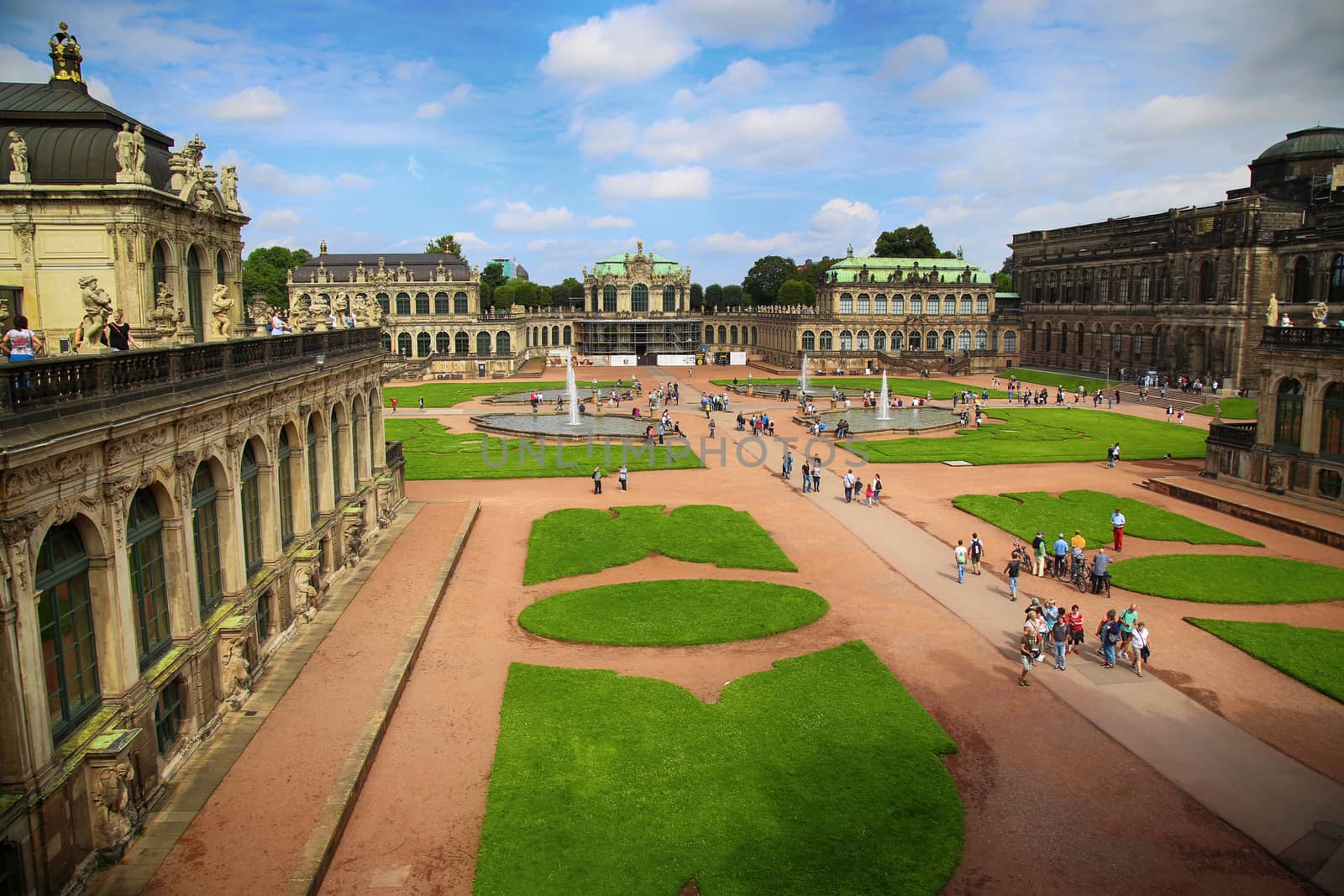 DRESDEN, GERMANY – AUGUST 13, 2016: Tourists walk and visit Dresdner Zwinger, rebuilt after the second world war, the palace is now the most visited monument  in Dresden, Germany on August 13, 2016.