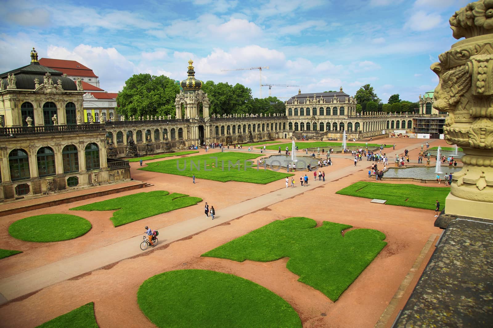 DRESDEN, GERMANY – AUGUST 13, 2016: Tourists walk and visit Dresdner Zwinger, rebuilt after the second world war, the palace is now the most visited monument  in Dresden, Germany on August 13, 2016.