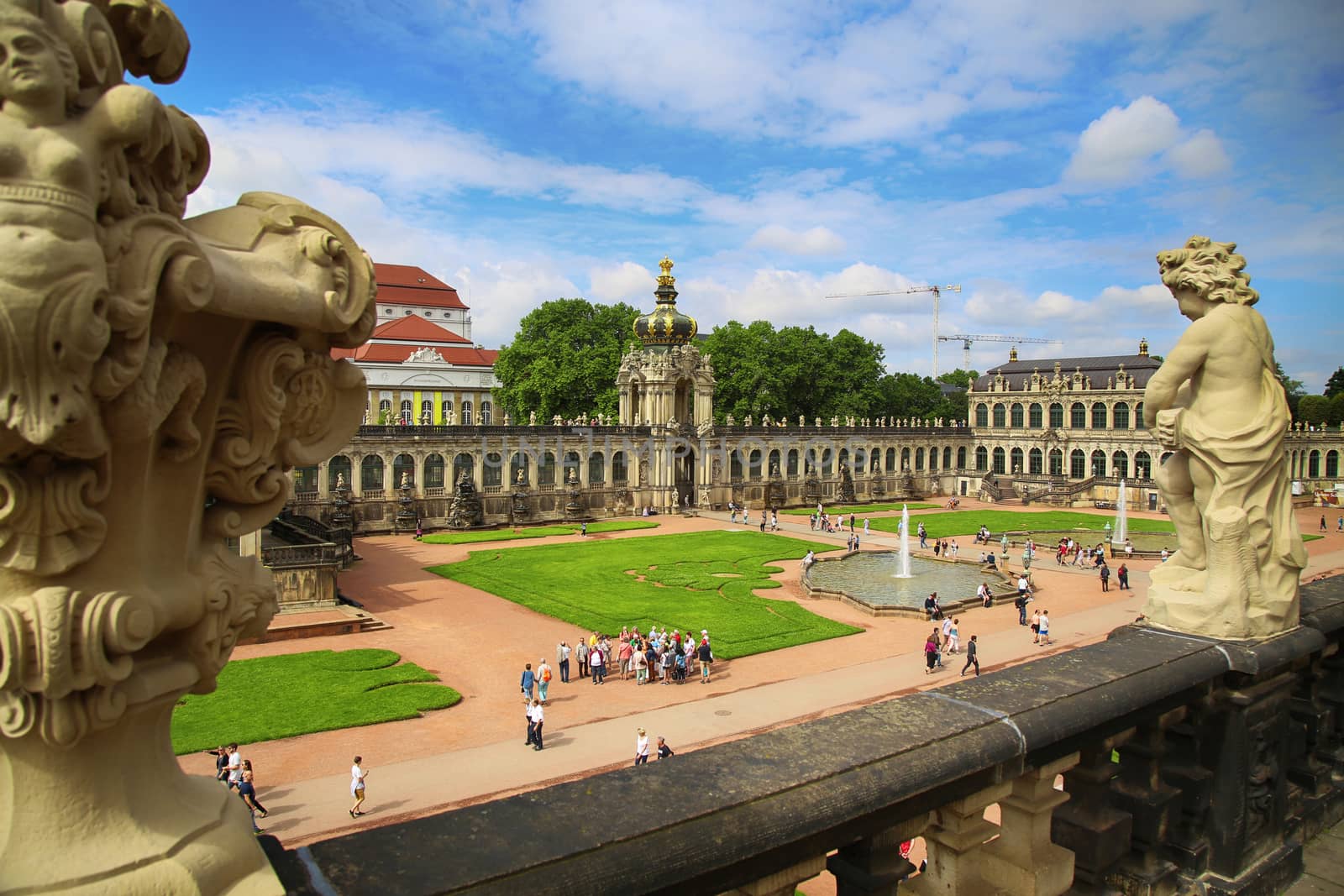 DRESDEN, GERMANY – AUGUST 13, 2016: Tourists walk and visit Dresdner Zwinger, rebuilt after the second world war, the palace is now the most visited monument  in Dresden, Germany on August 13, 2016.