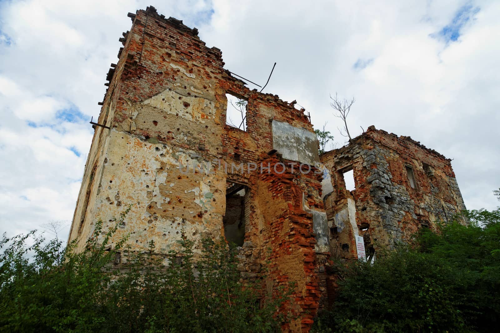Ruined house in Open air museum of the Croatian War of Independence (1991-1995) in Karlovac, Croatia by slavapolo