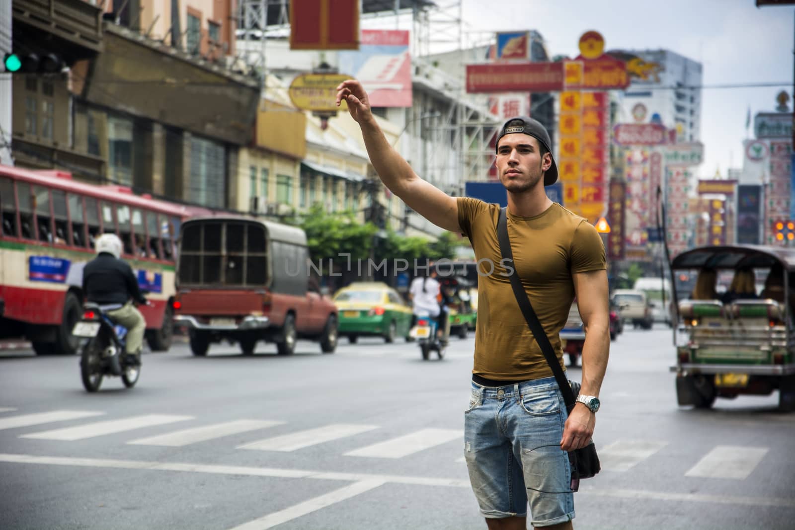 Man standing with hand up by artofphoto