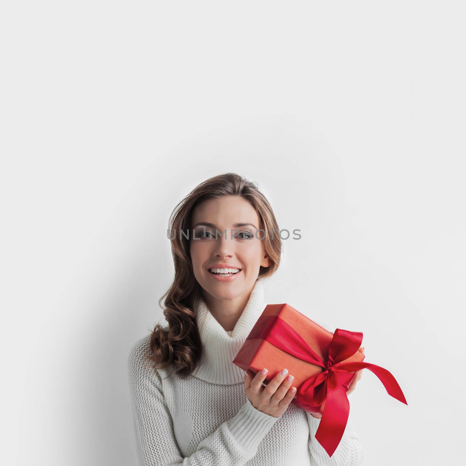 Woman hold christmas or new year decorated gift box