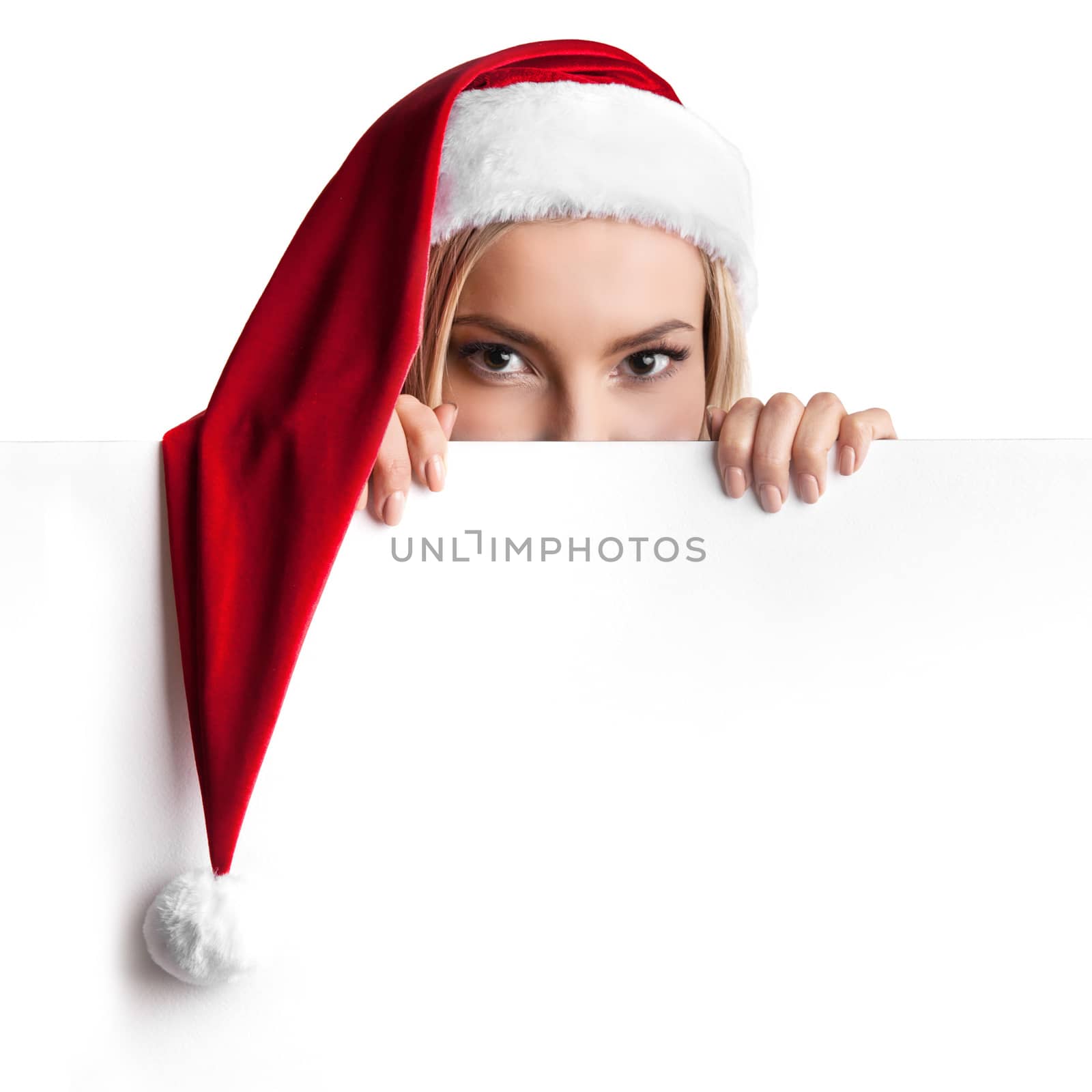 Christmas woman in Santa hat holding blank empty board banner isolated on white