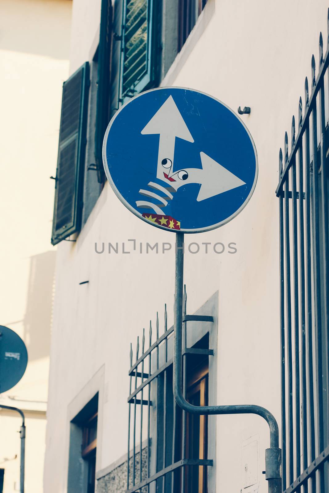 Road signs in Florence, Italy. The arrows in the form of spring