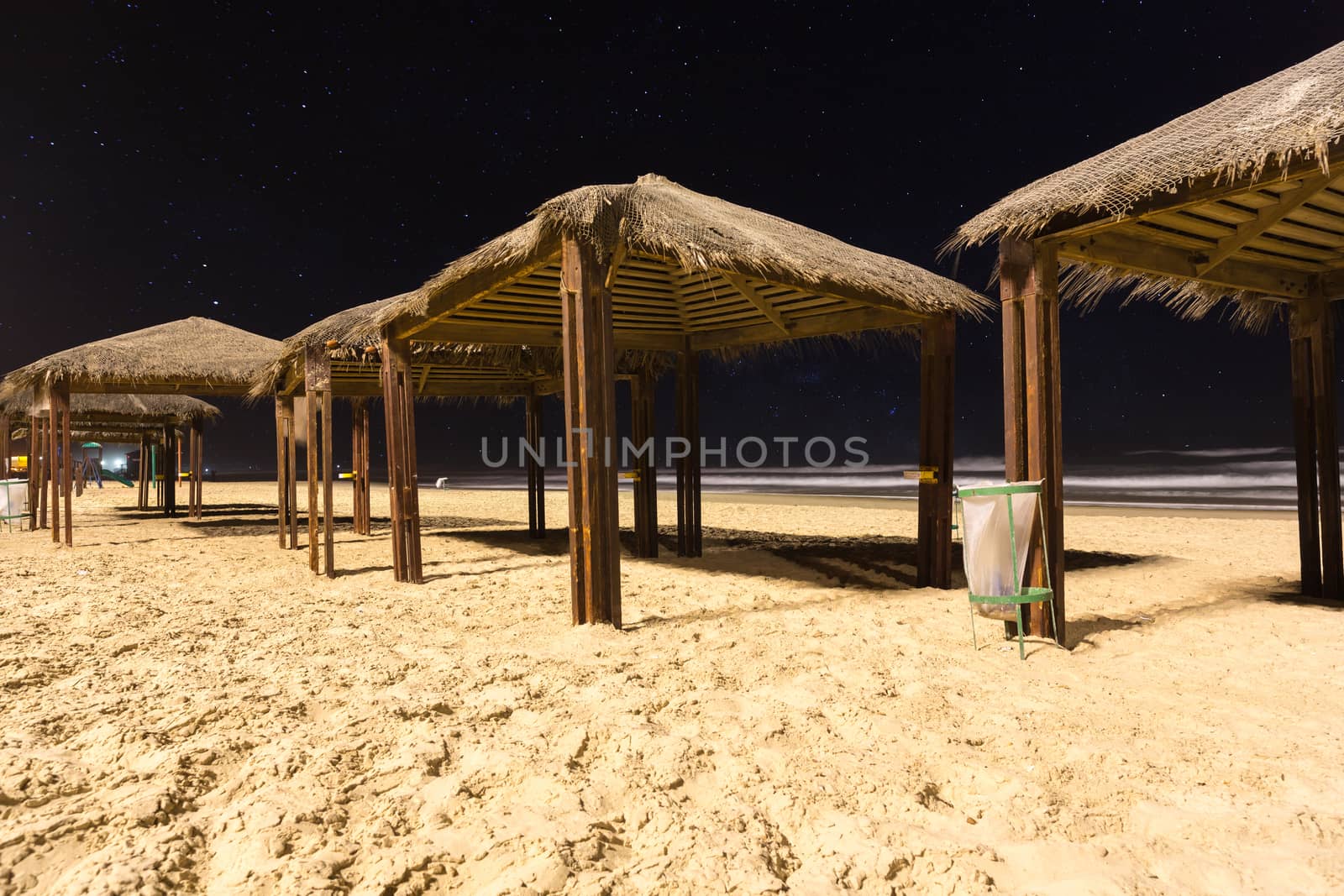 canopies from sun on the beach at night