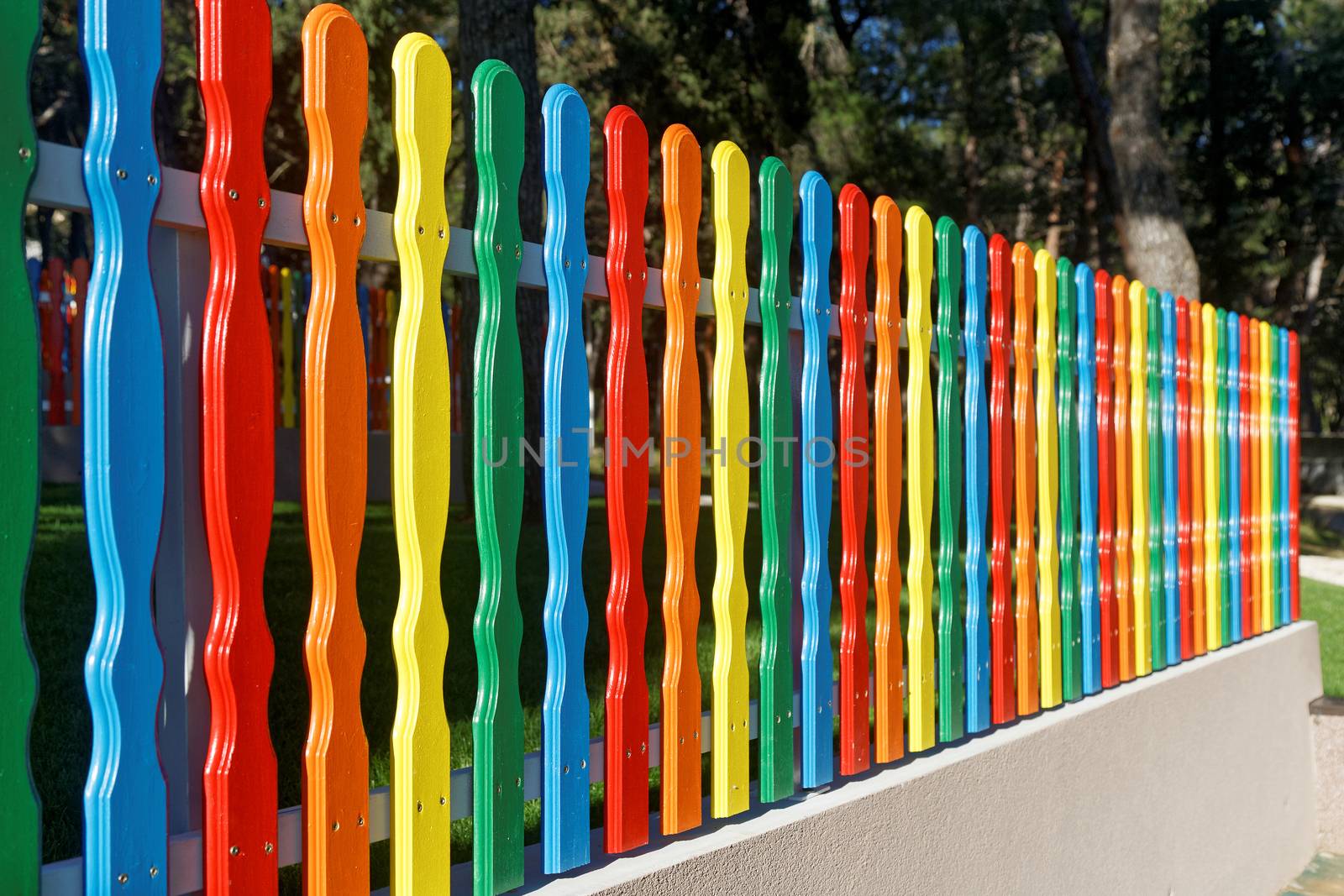 Multicolored fence by sewer12