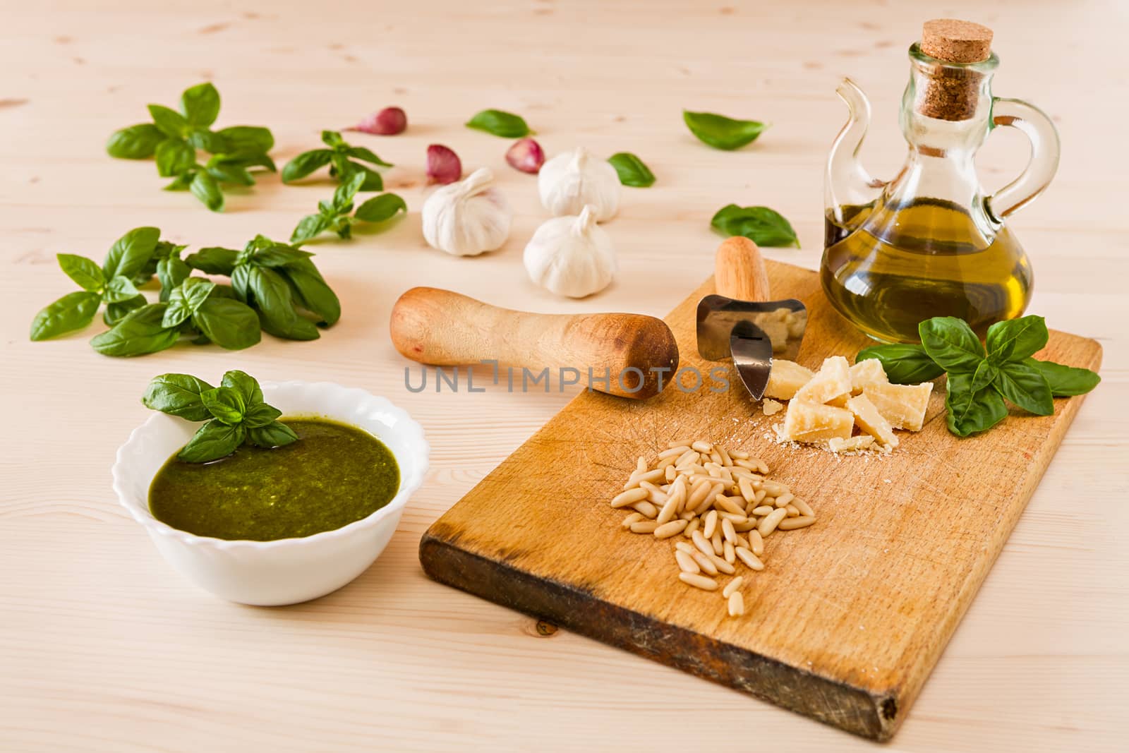 Fresh pesto genovese sauce over a wooden background
