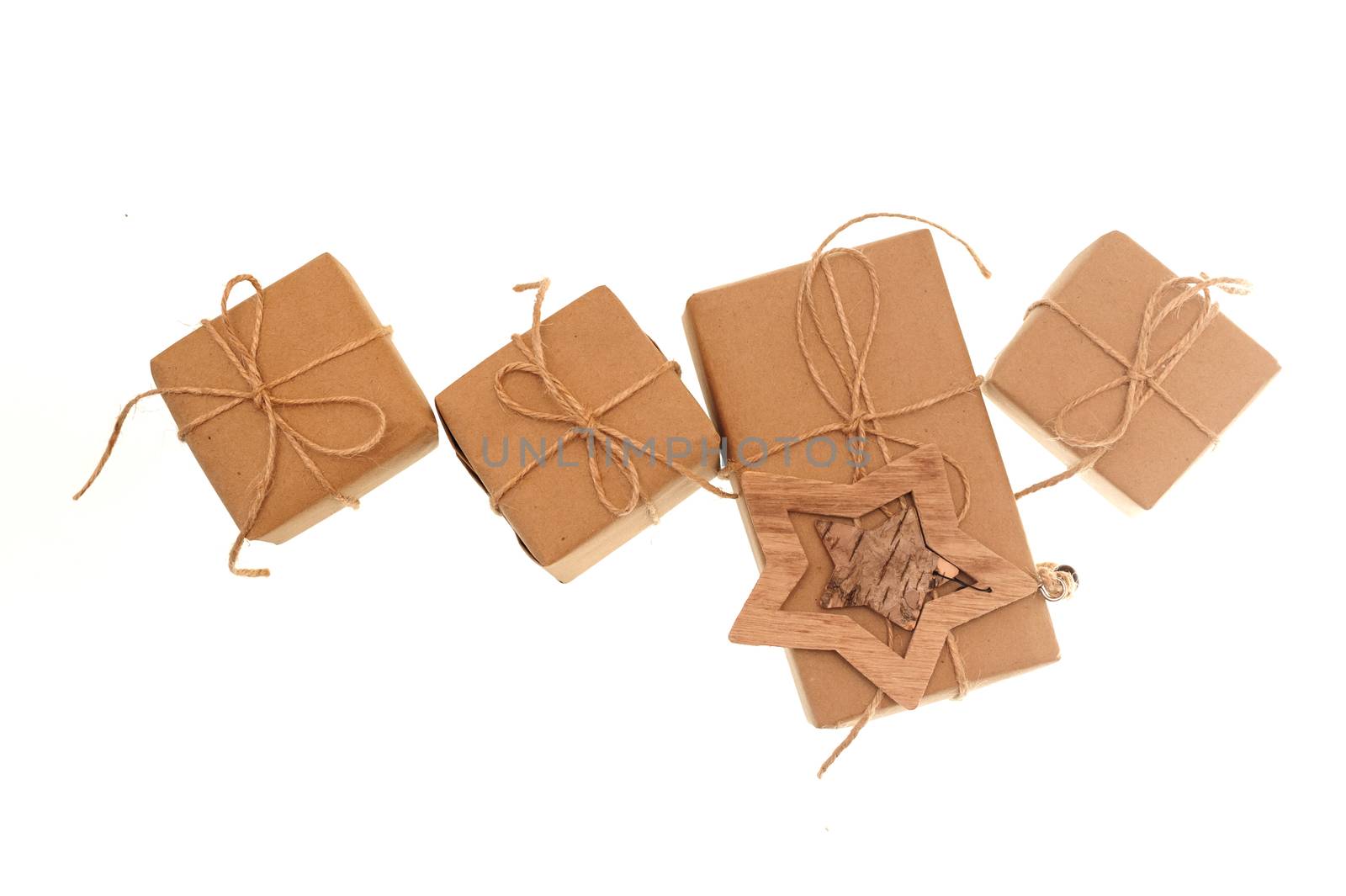 gift boxes of kraft paper tied with a rope on a white background.