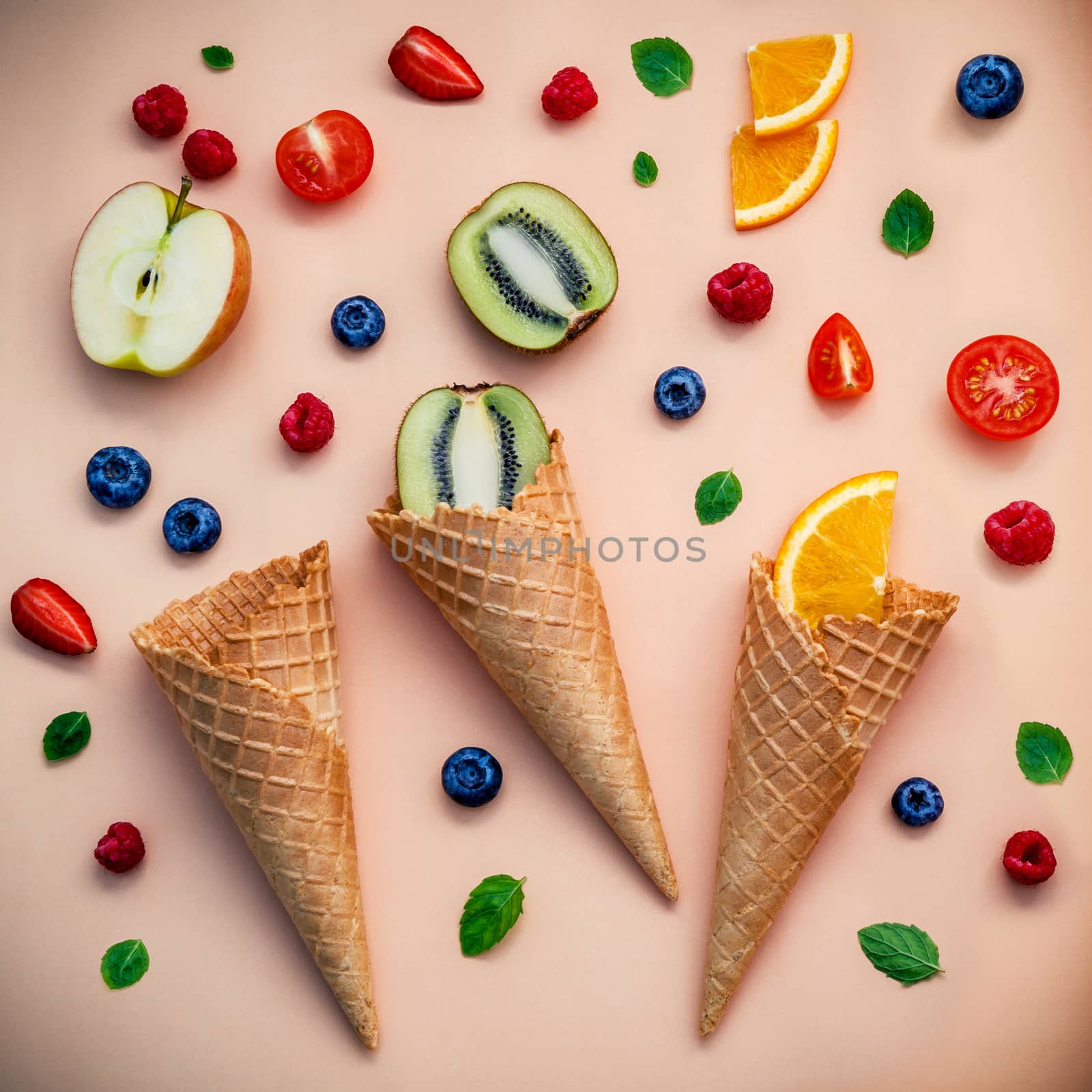 Cones and colorful various fruits raspberry ,blueberry ,strawber by kerdkanno