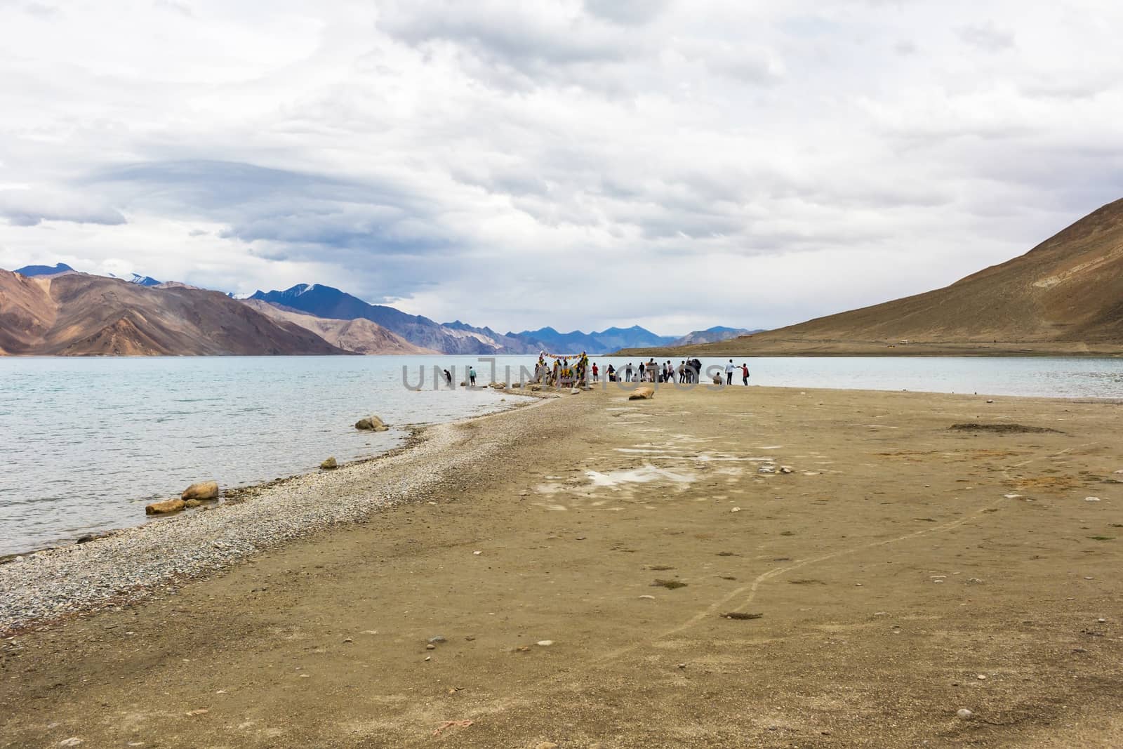 Tourist in Pangong lake in Leh Ladakh, Jammu and Kashmir, India