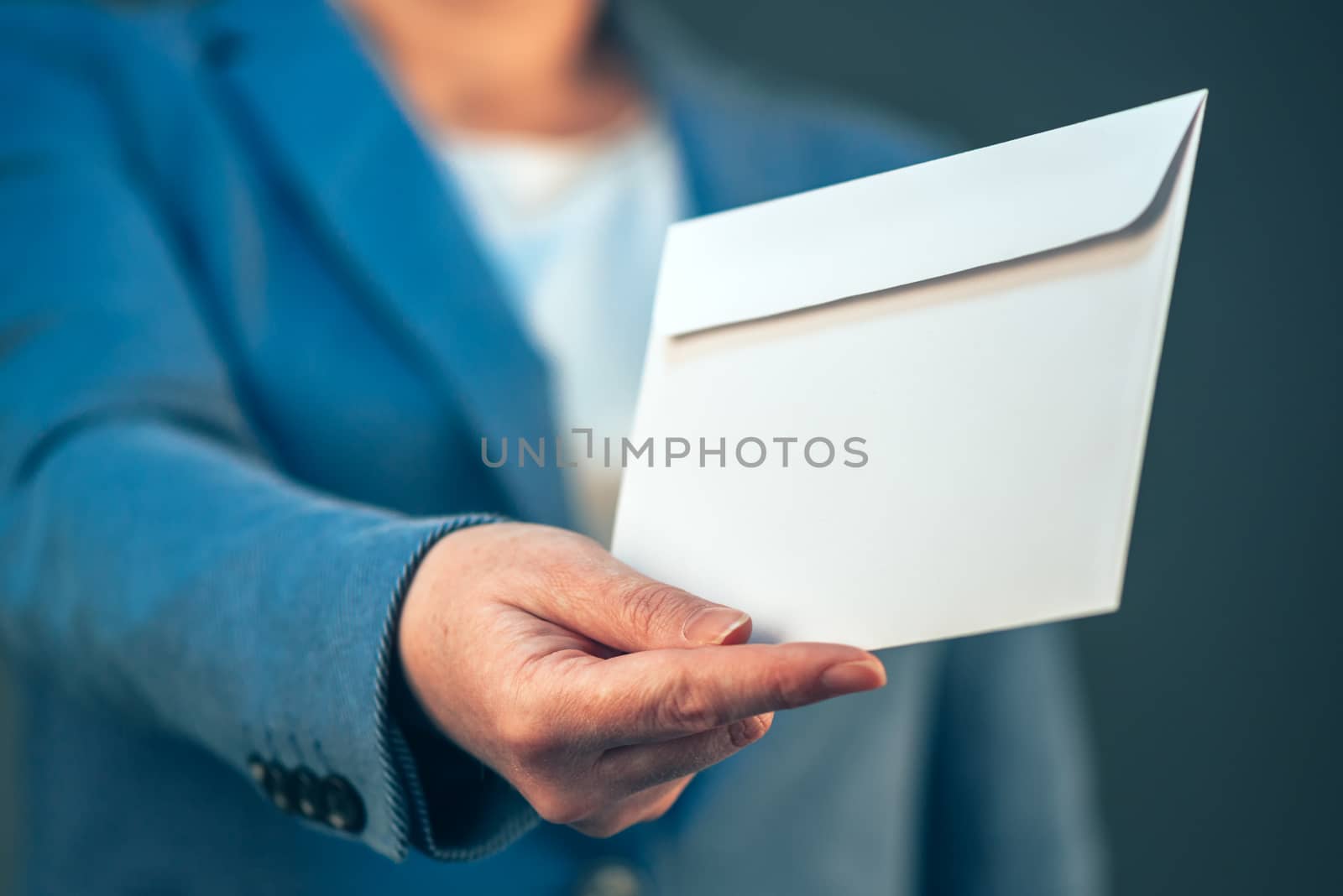 Business woman offering white envelope as bribe by stevanovicigor