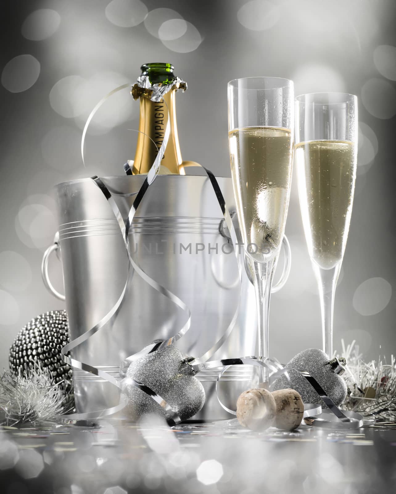Pair glass of champagne with bottle in metal container. New Year by janssenkruseproductions