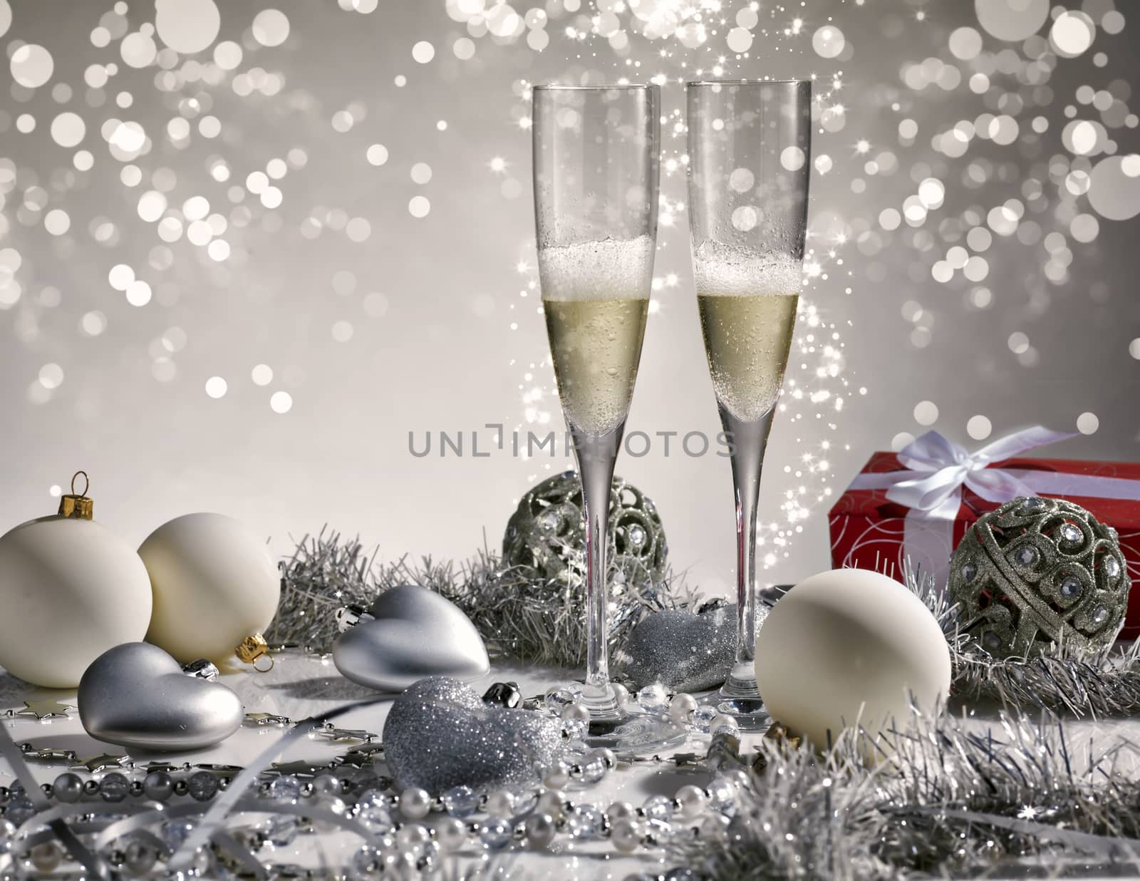 Two champagne glasses ready to bring in the New Year by janssenkruseproductions