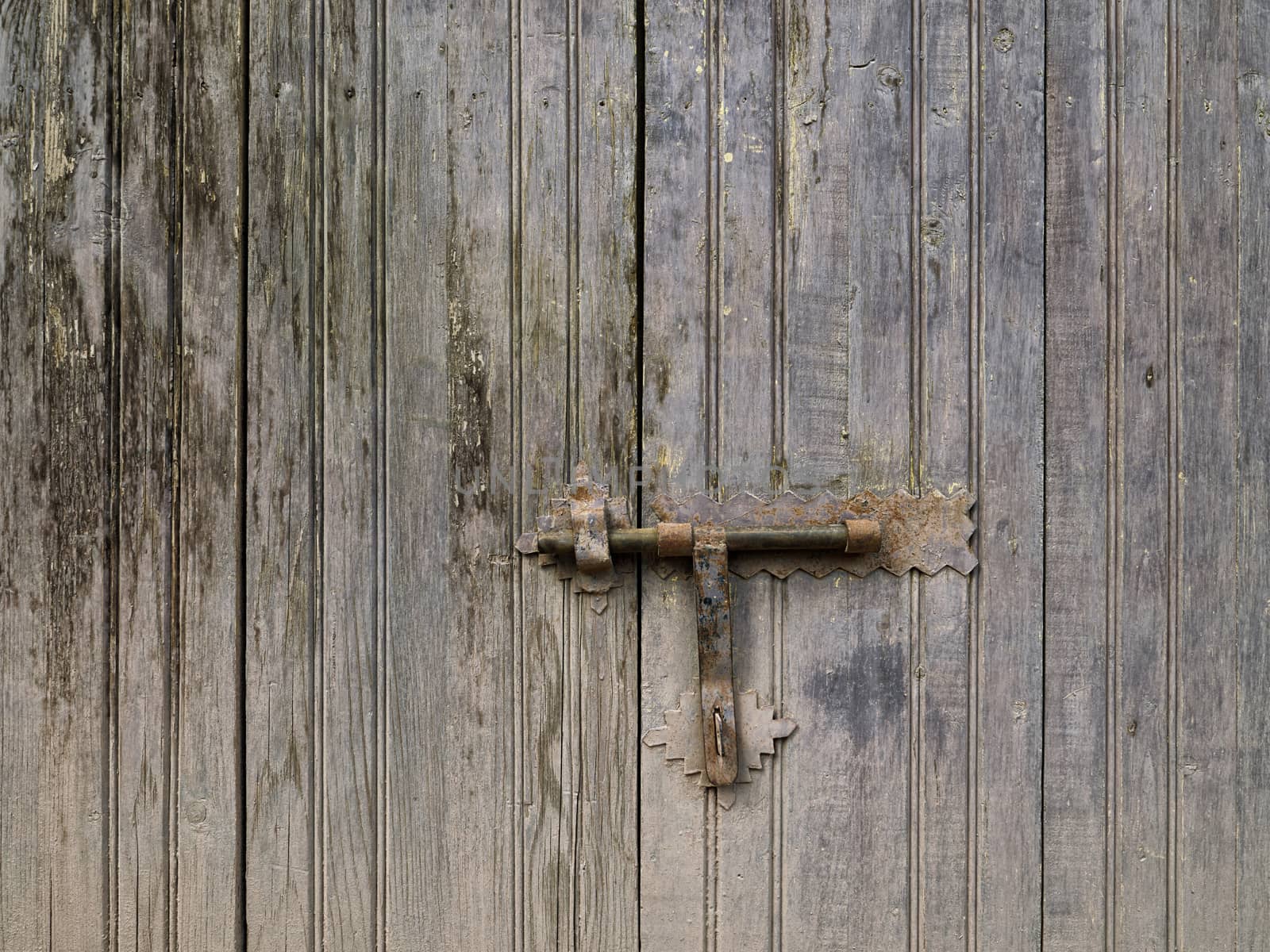 Old door lock and rusty latch
