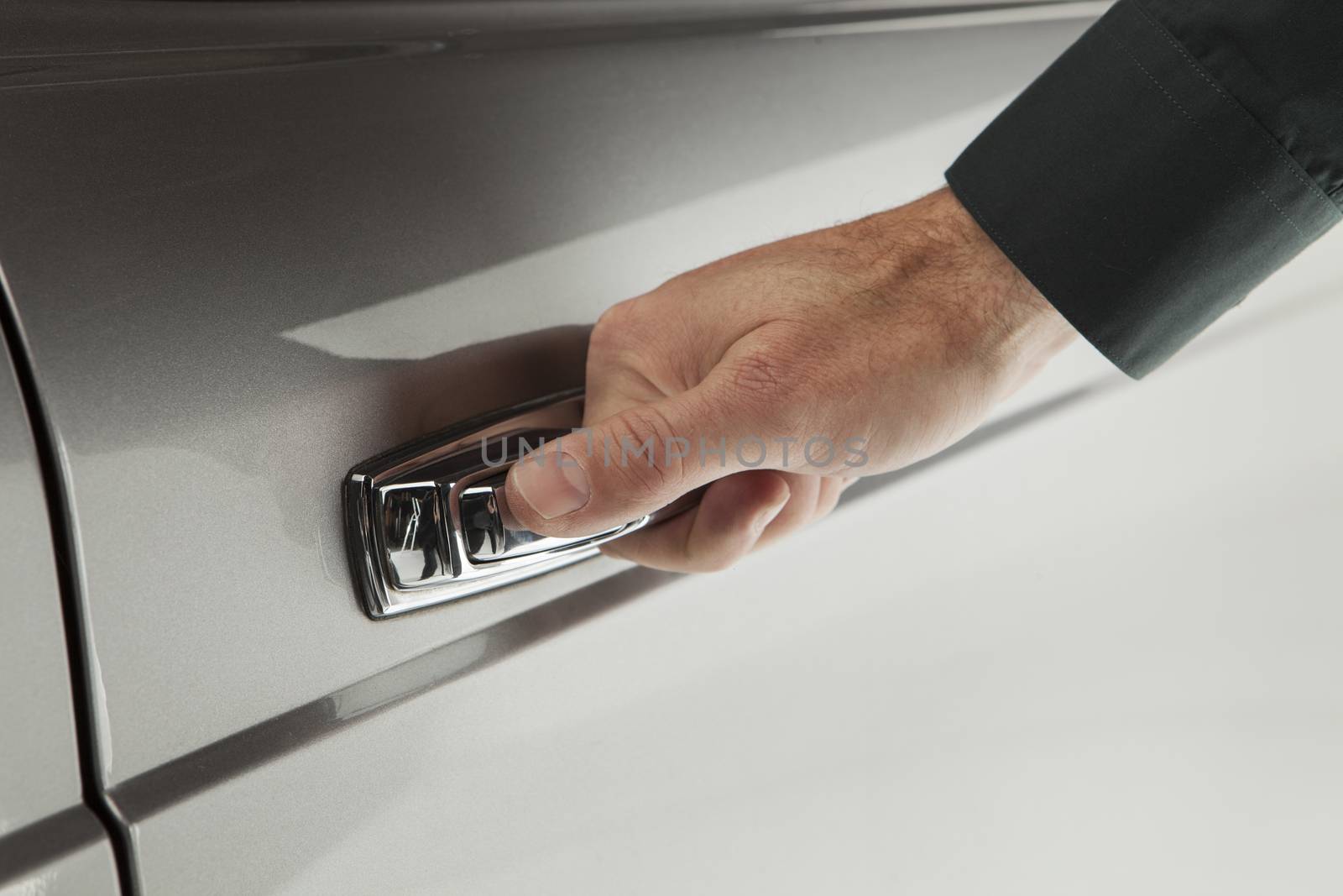 Close up of a man opening a car door by janssenkruseproductions