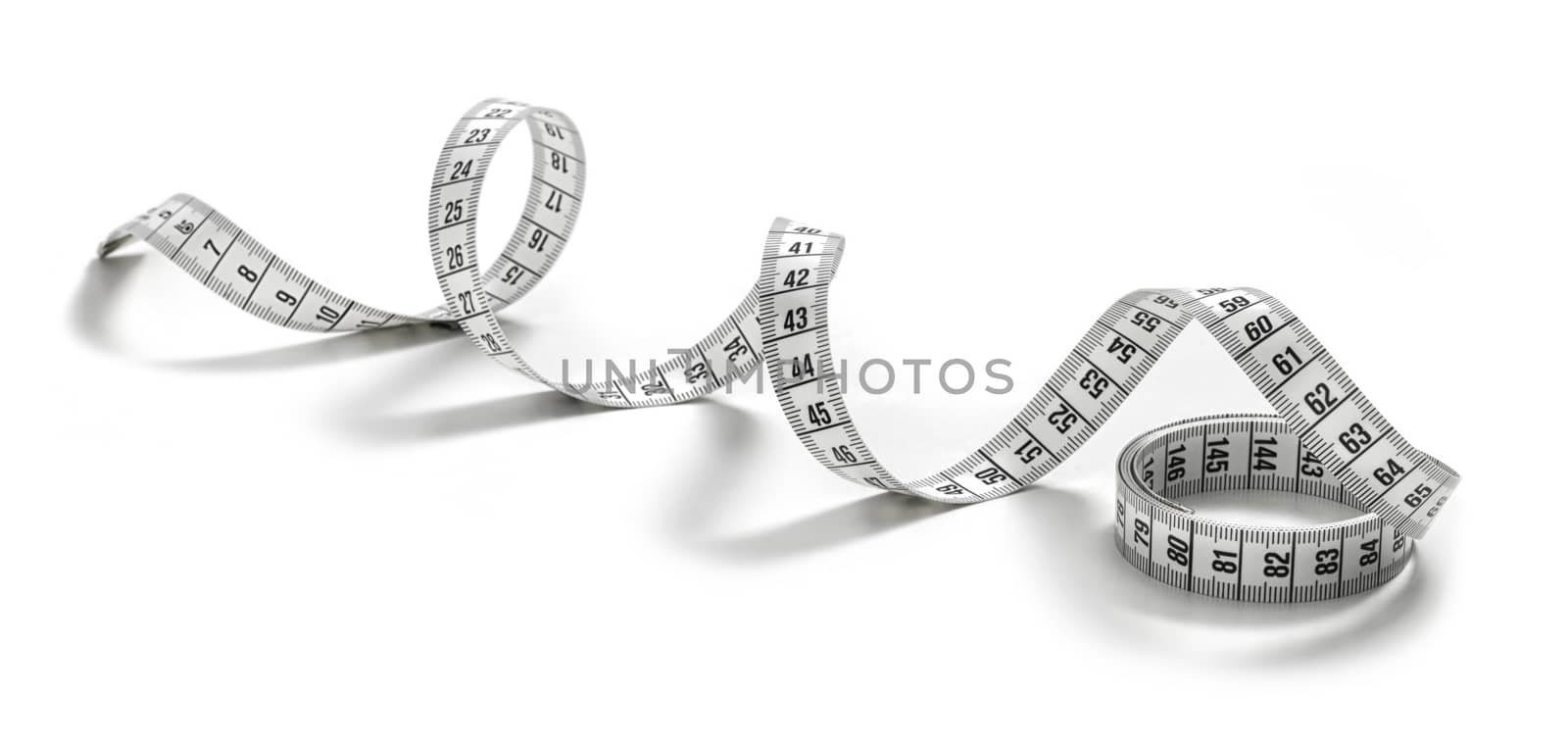 white tape measuring isolated on a white by janssenkruseproductions