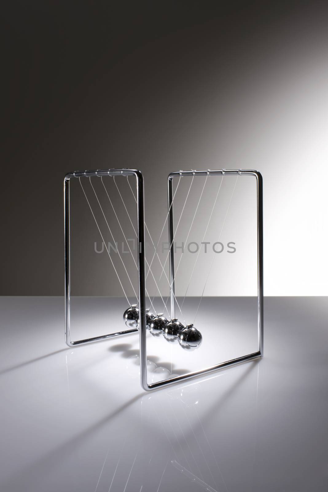 Chrome balancing spheres know as Newton's Cradle (pendulum)