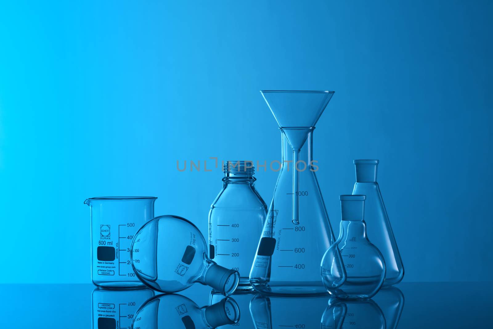 Laboratory Glassware Science Lab on a blue background by janssenkruseproductions