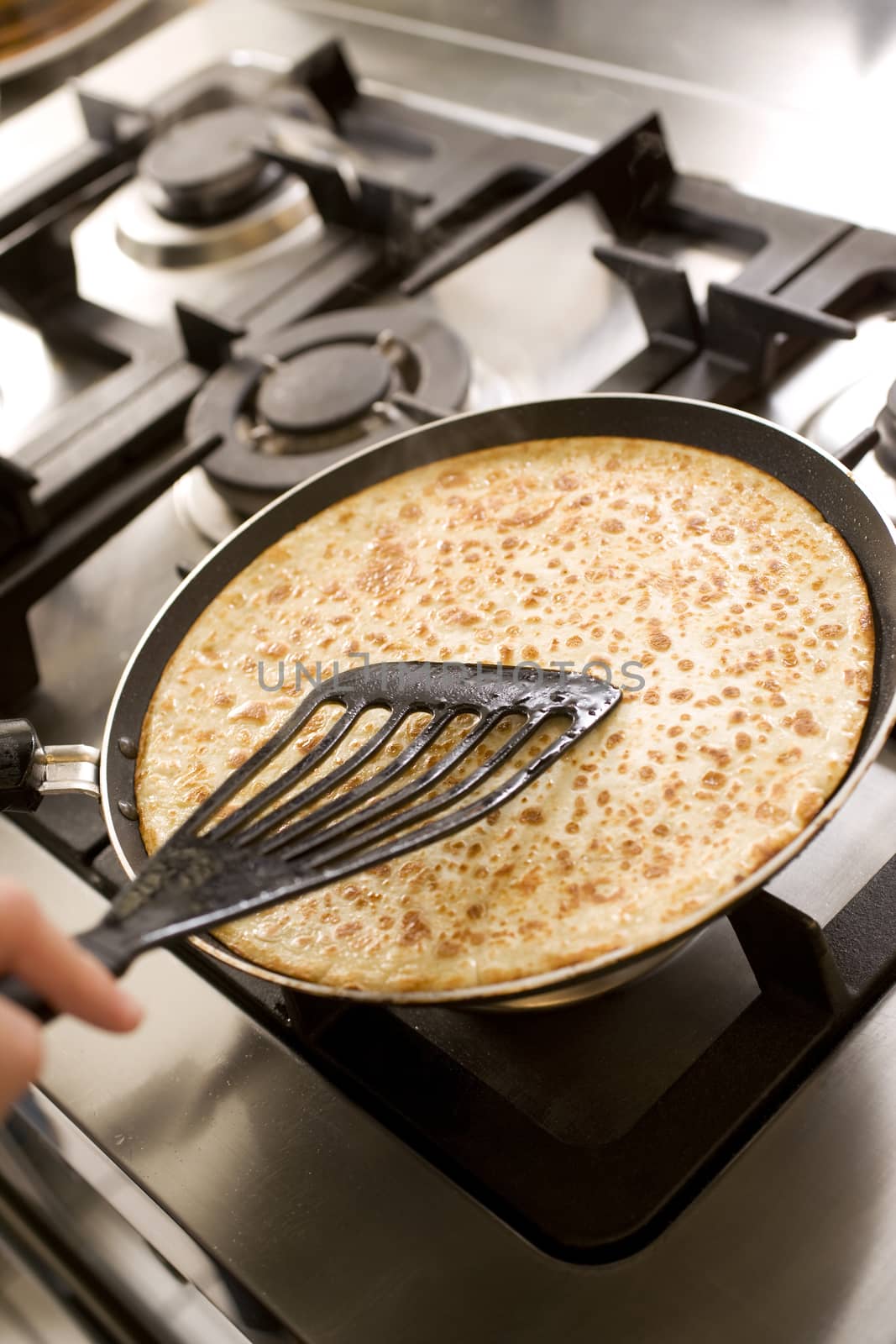 pancakes cooking on the hot stove