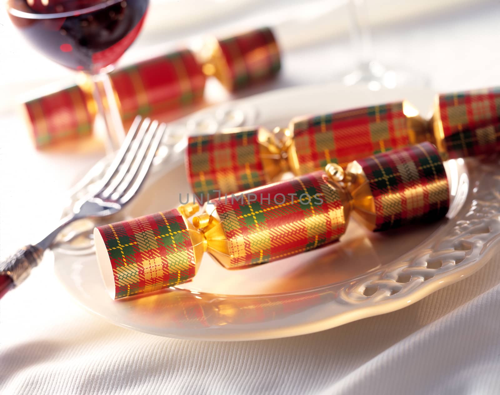 Christmas crackers with fork on a dinnerplate