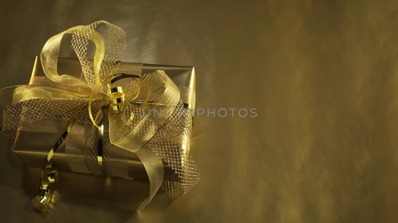 Golden gift box with baubles decorations and candles, Christmas