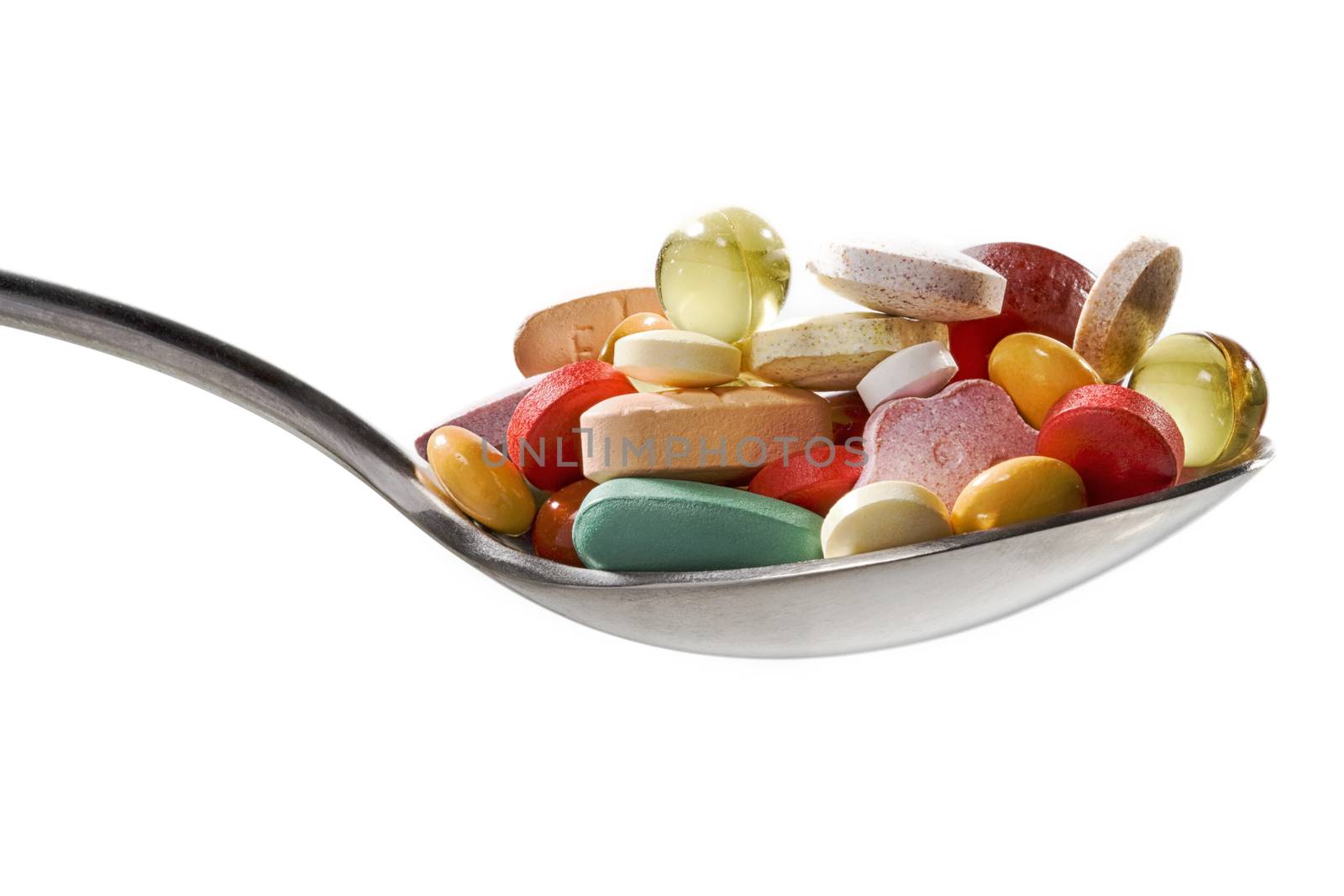 Spoon with all kind of medicines and vitamines