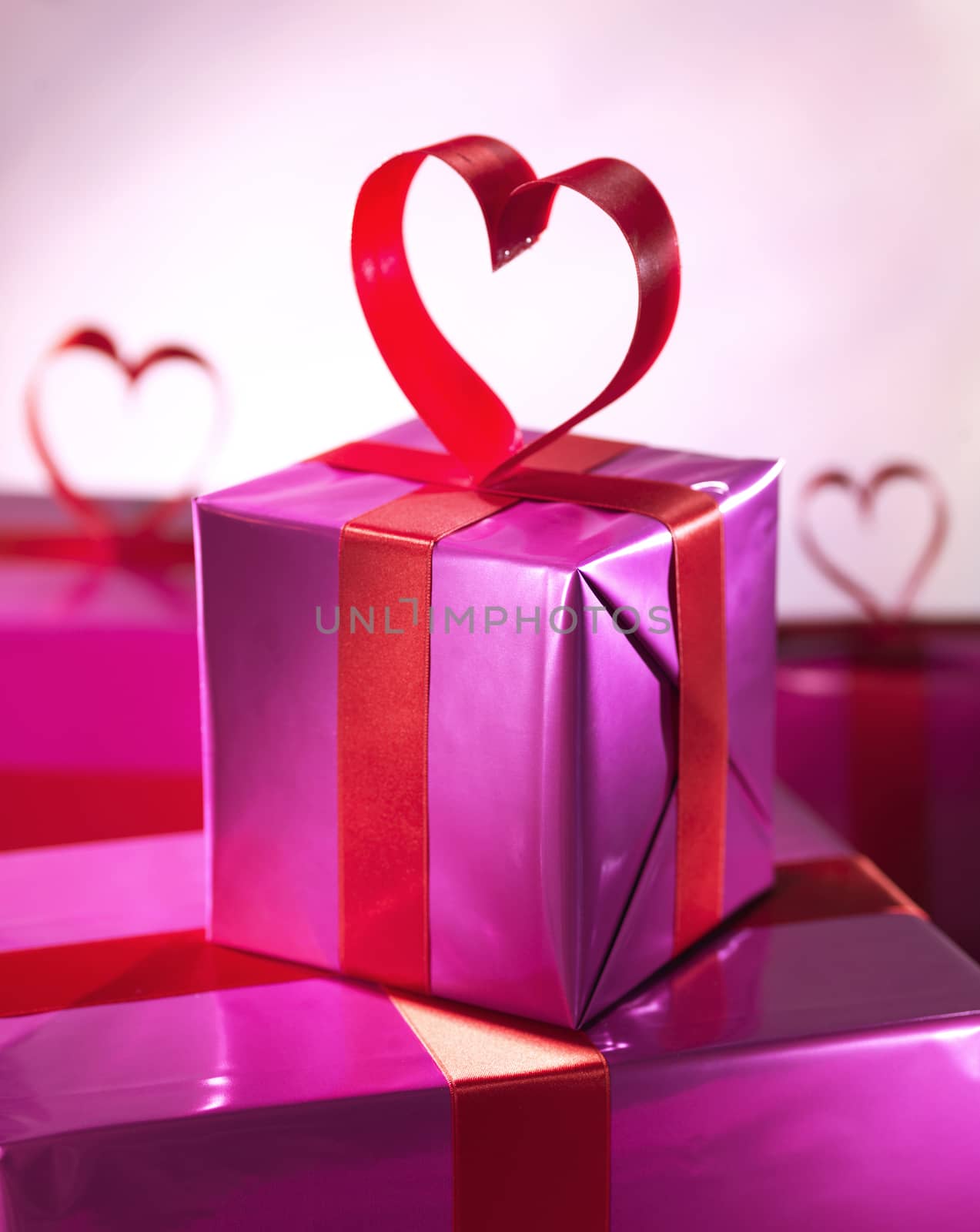 Red love heart gift box over red by janssenkruseproductions