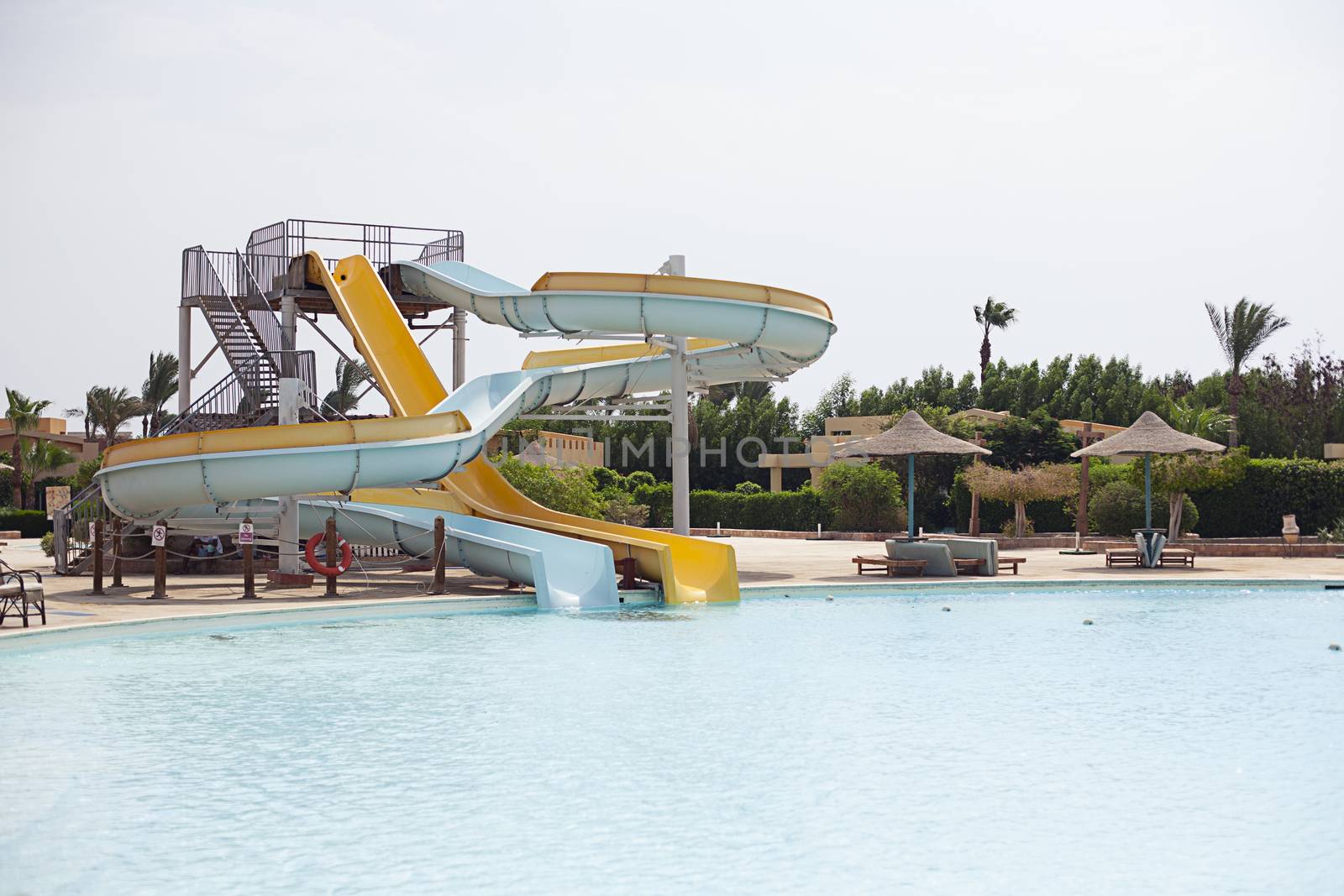 Aquapark, cleaner cleans a swimming pool Sharm el Sheikh, Egypt