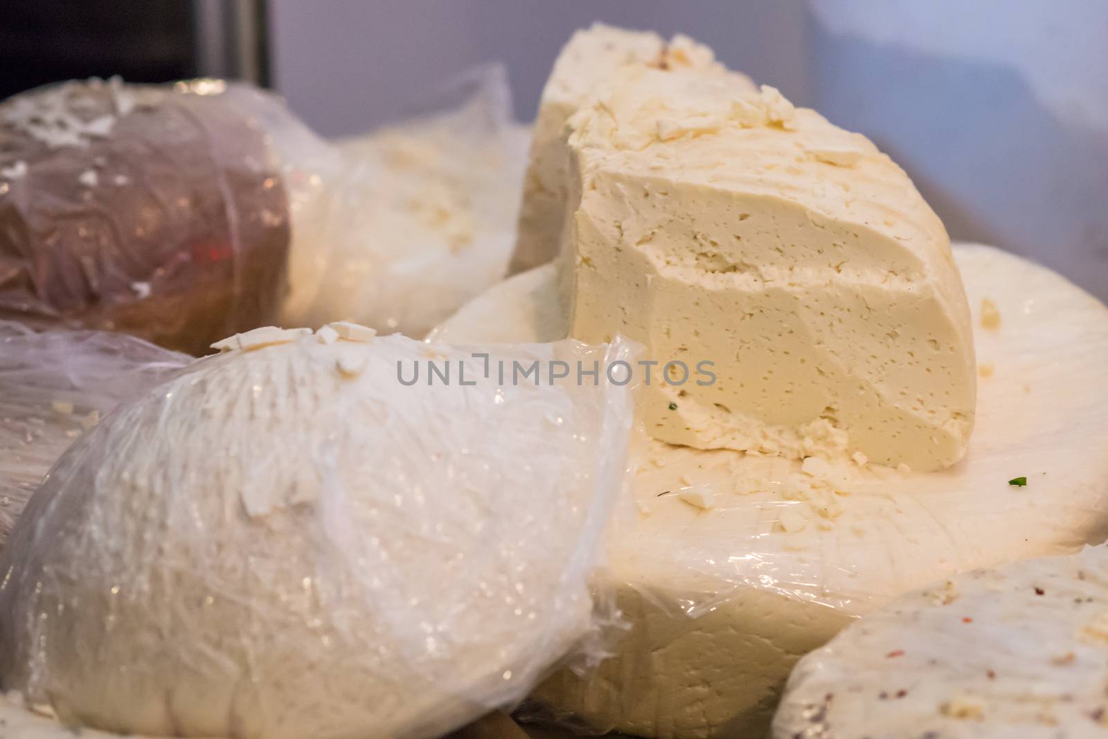 piece of fresh white cheese by okskukuruza