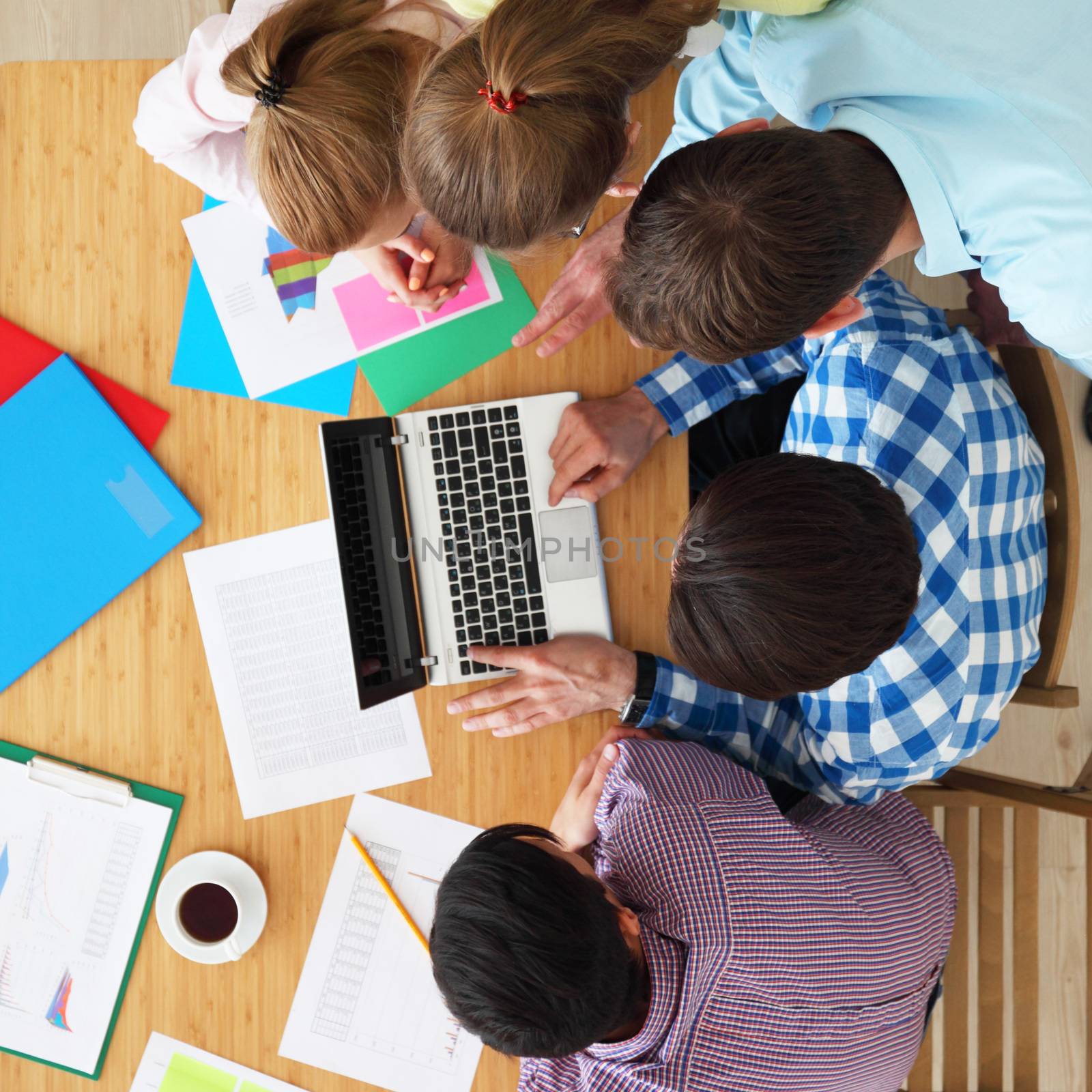 Group of diverse cheerful business people work together