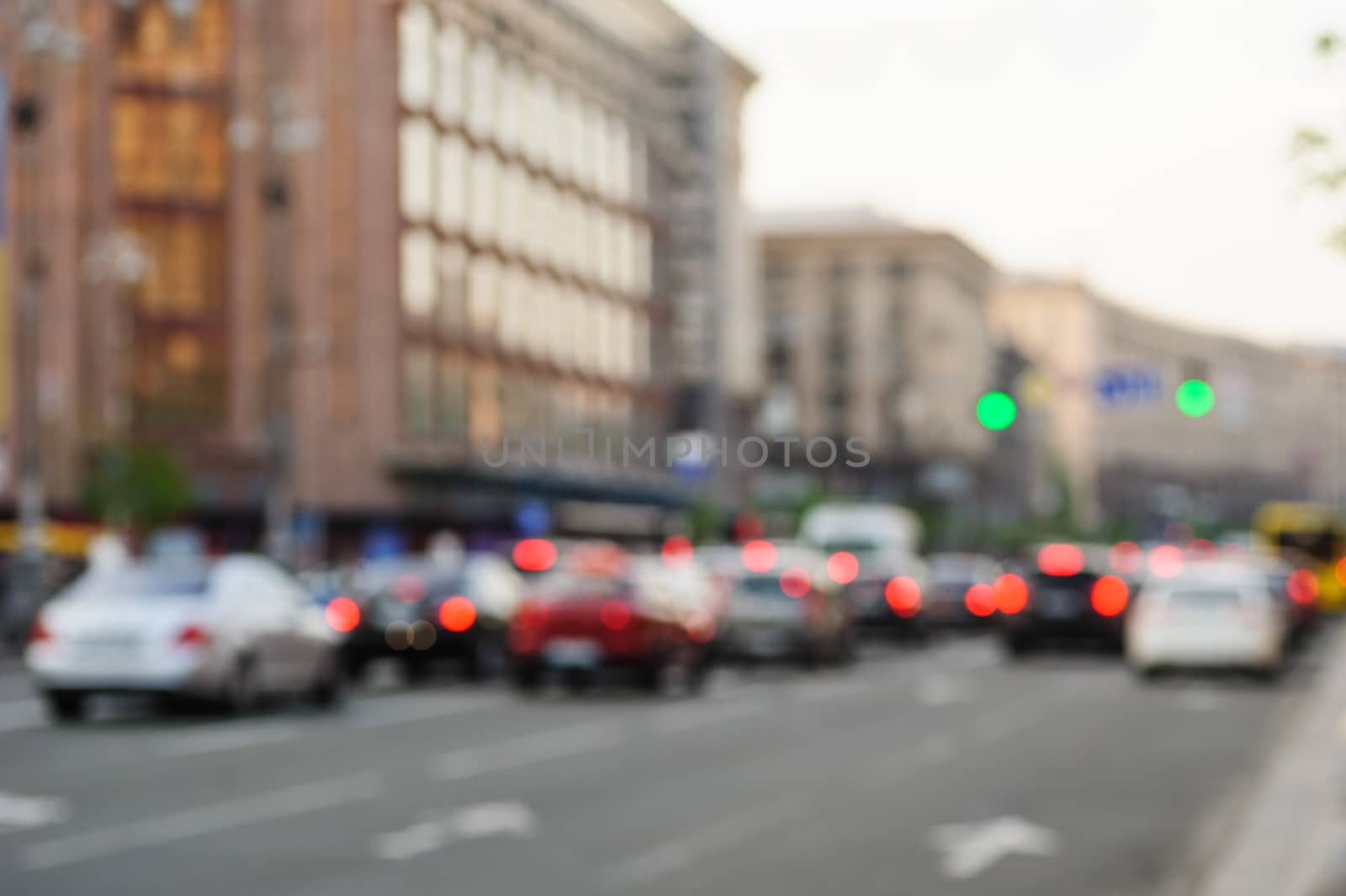 cars in big city on road with blurred focus.