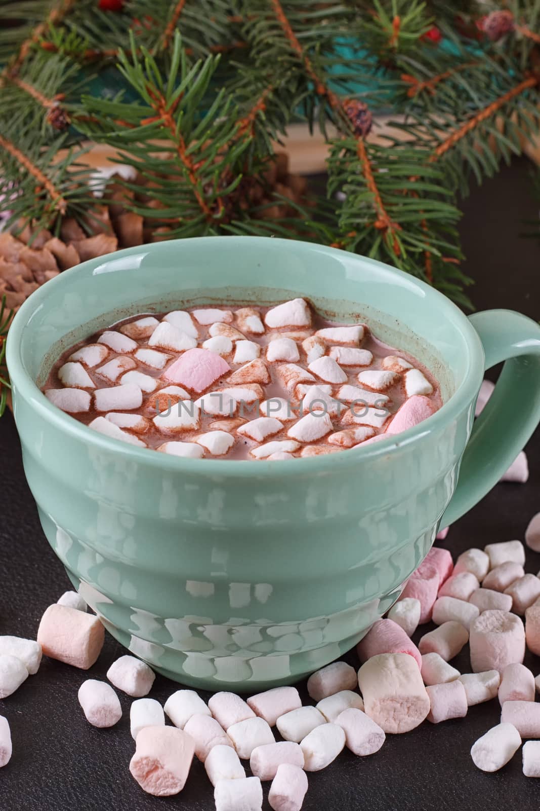 mug with hot chocolate and burning lantern on wooden table