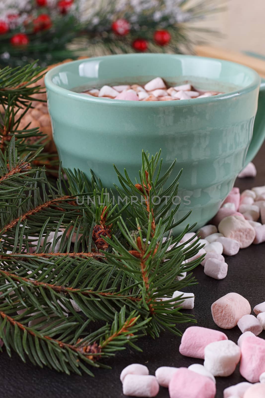 mug with hot chocolate and burning lantern on wooden table