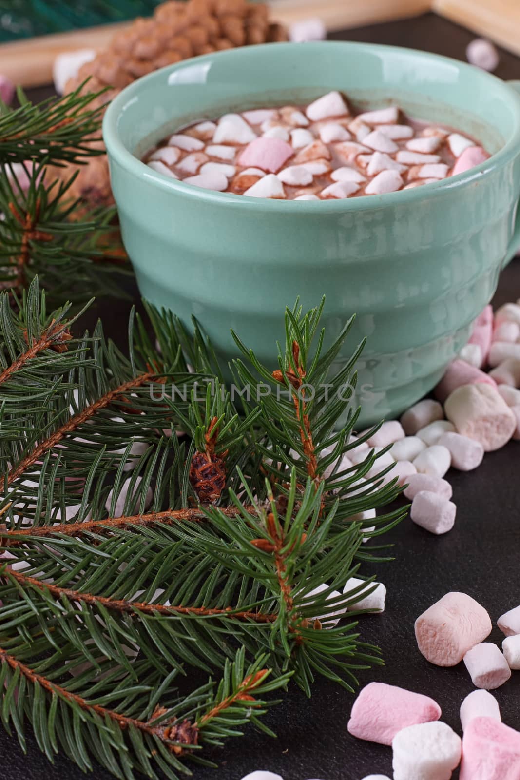 mug with hot chocolate and burning lantern on wooden table