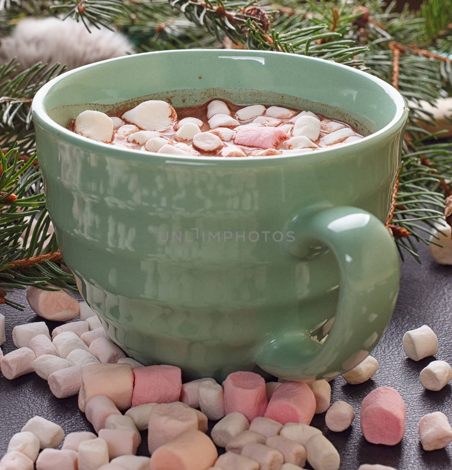 mug with hot chocolate and burning lantern on wooden table