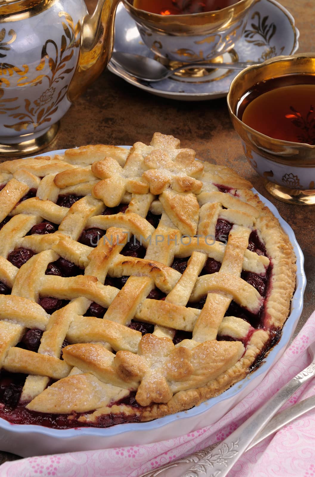 cherry pie dough with decorative ornaments in  roasting pan