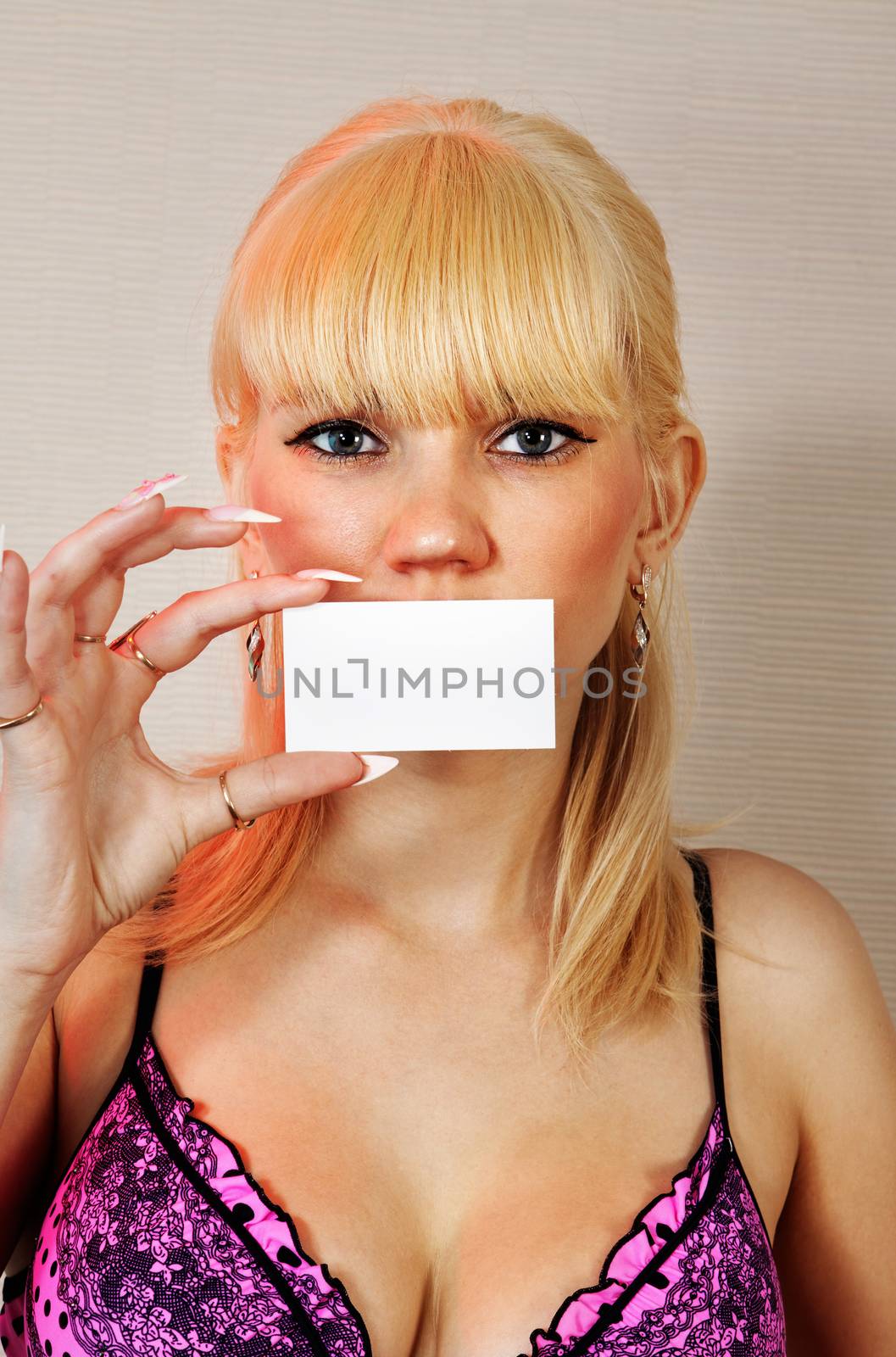 Business card or gift card. Blonde woman showing blank empty paper card with copy space for your design