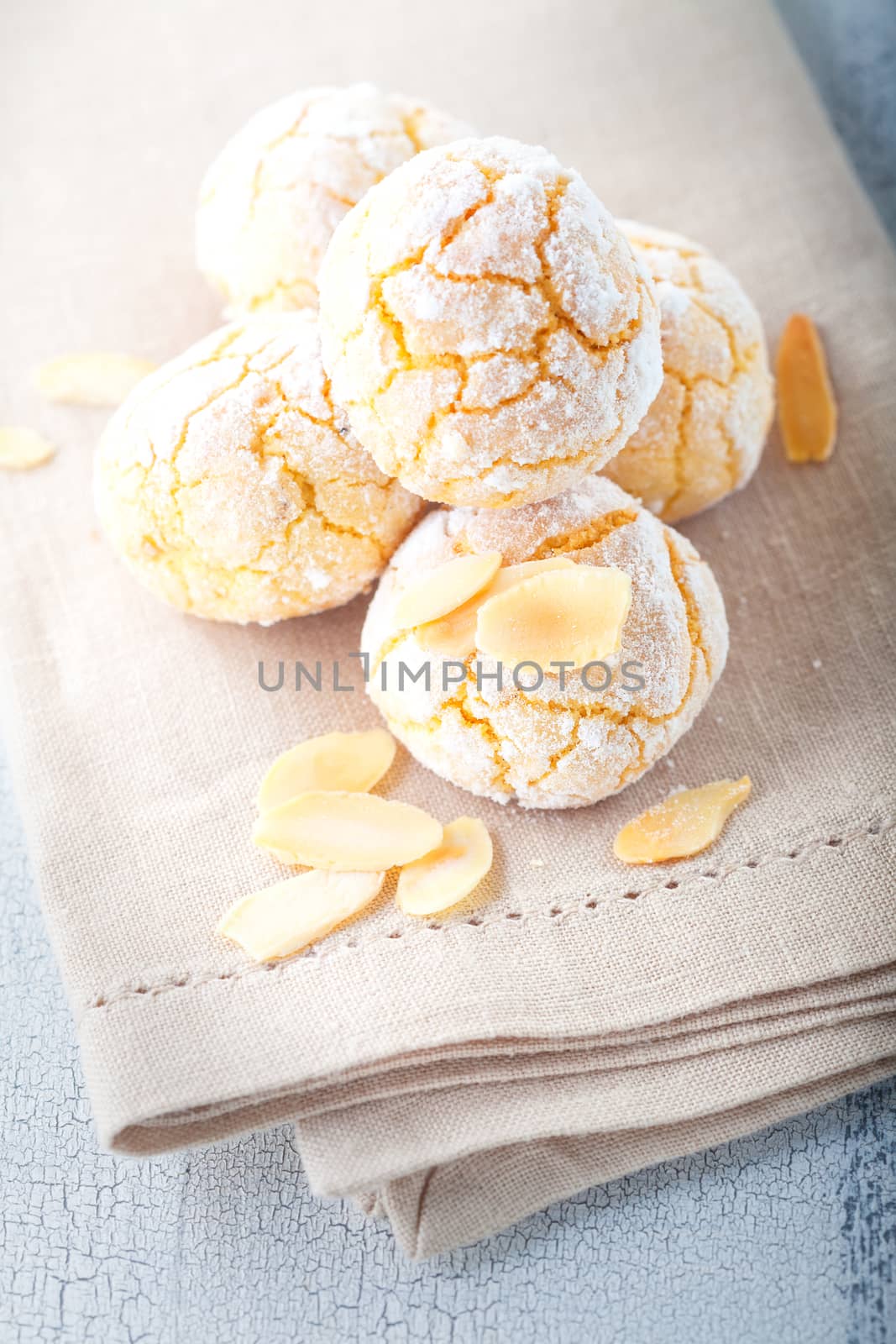Almonds Cookies Macaroon snowie peaks on a napkin.