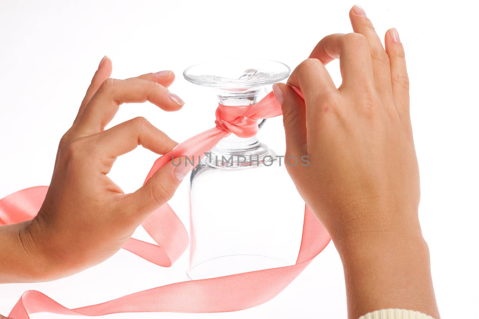 Woman's hand and band on a glasses