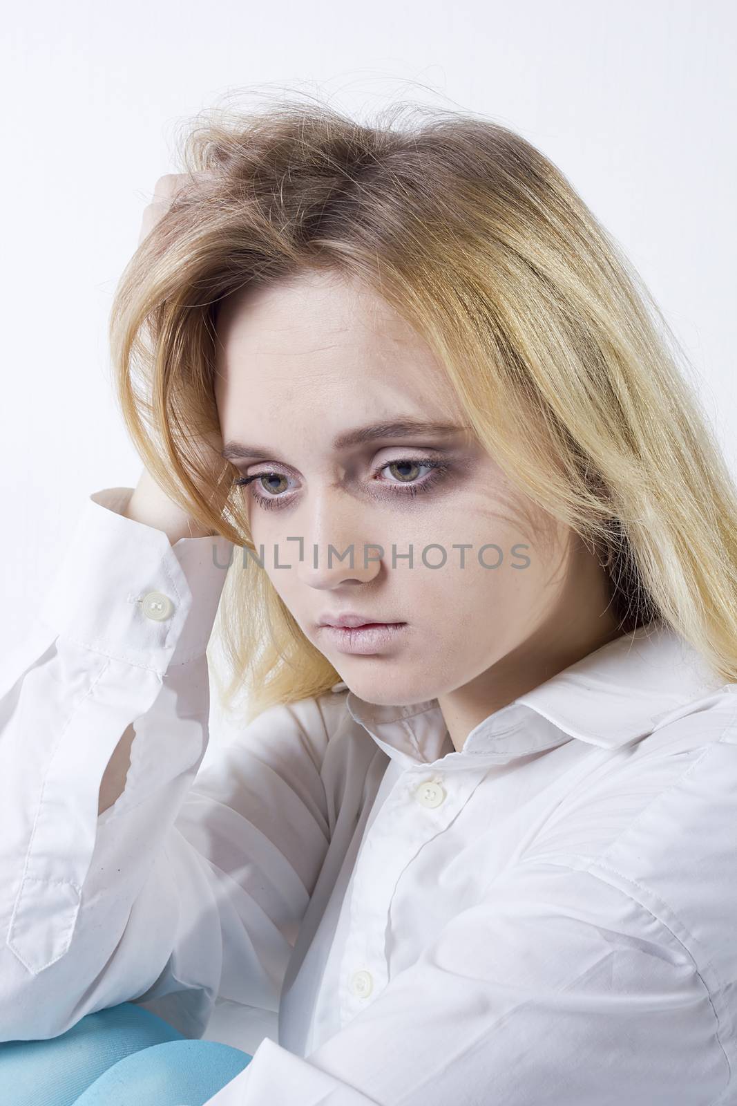 Young woman with depression isolated on white background