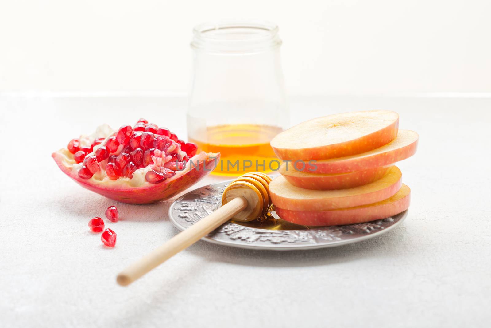 Apples, pomegranate and honey for Rosh Hashanah  by supercat67