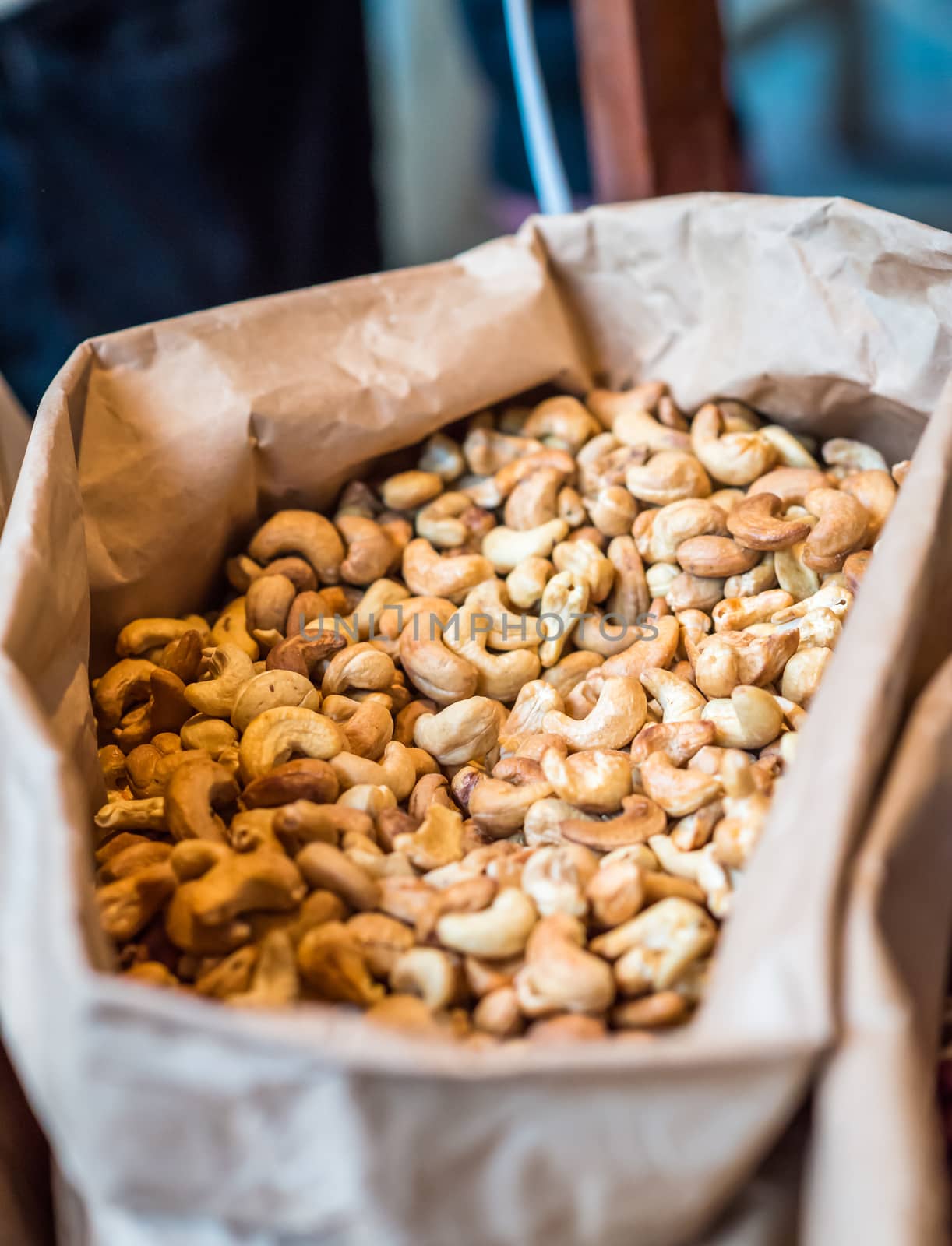 cashew nuts in a paper bag for sale