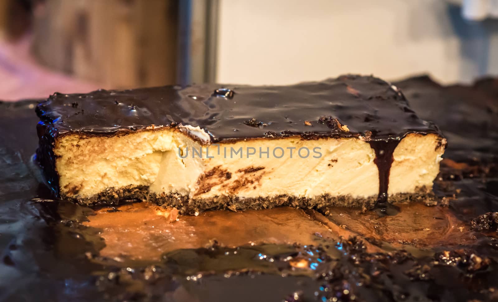 piece of cheesecake with chocolate frosting on sale