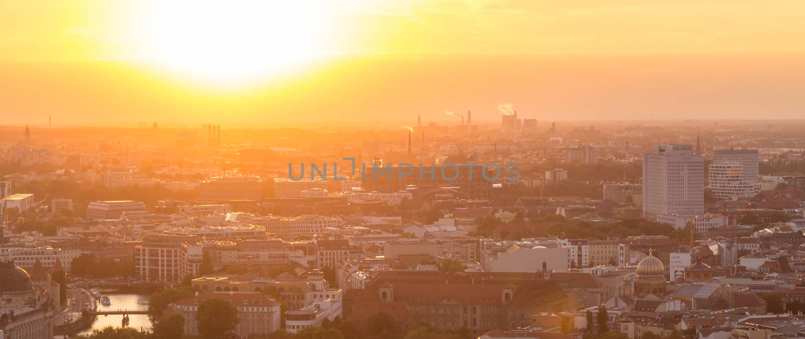 Beautiful panoramic aerial view over Berlin, Germany, in romantic colorful sunset.