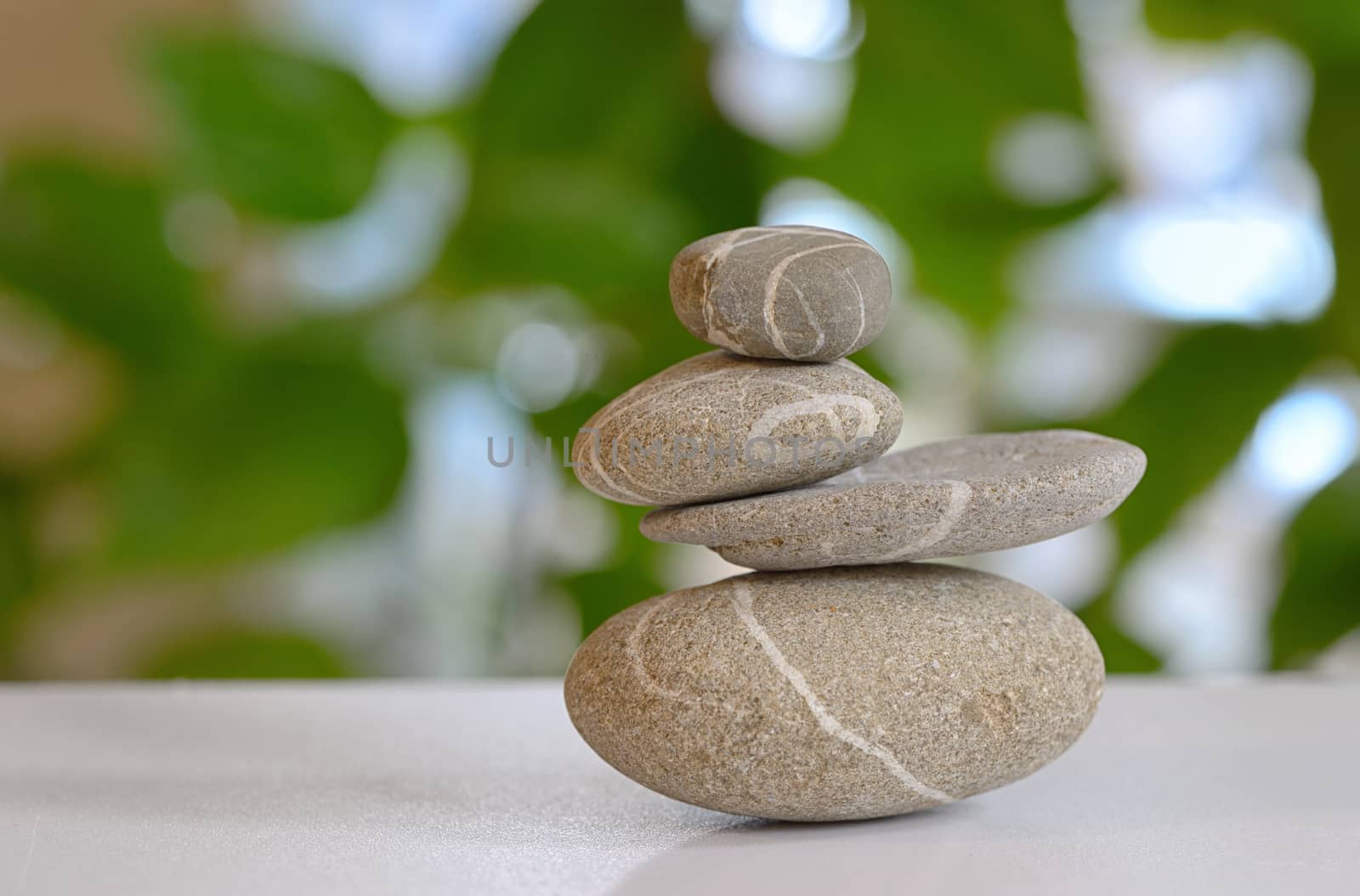 pebble stones pyramid with nature in background