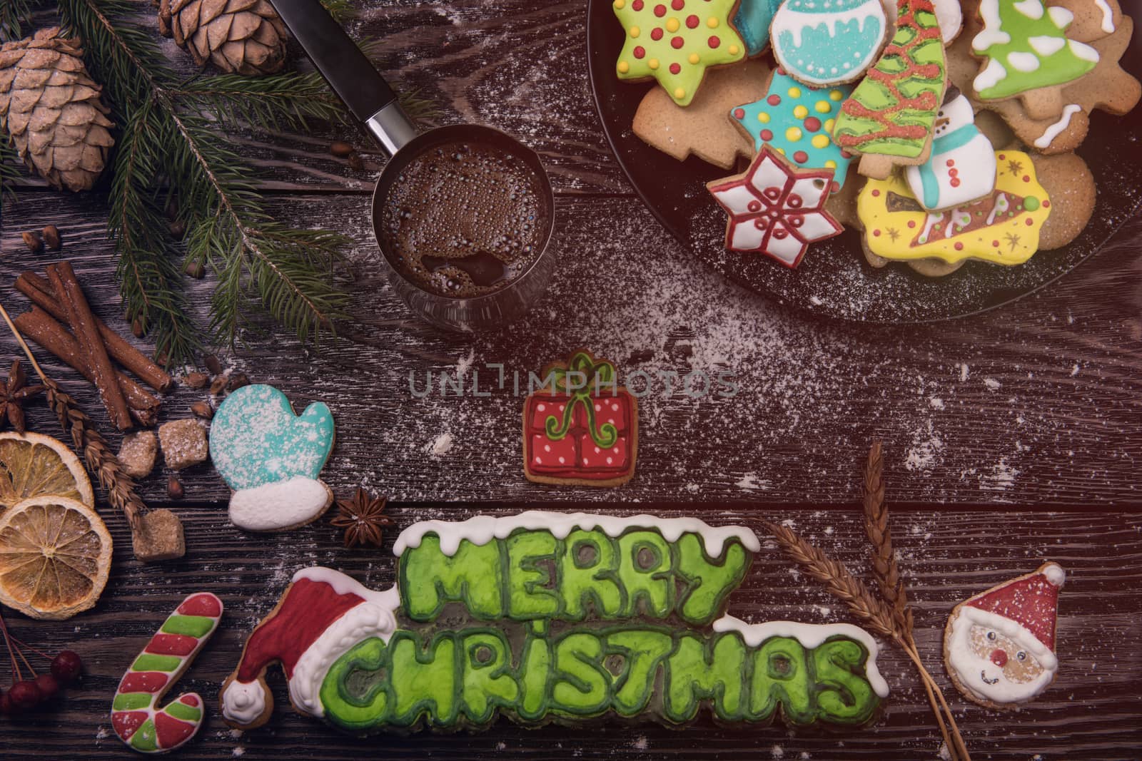 Different ginger cookies and coffee for new years and christmas on wooden background, xmas theme. Top view.