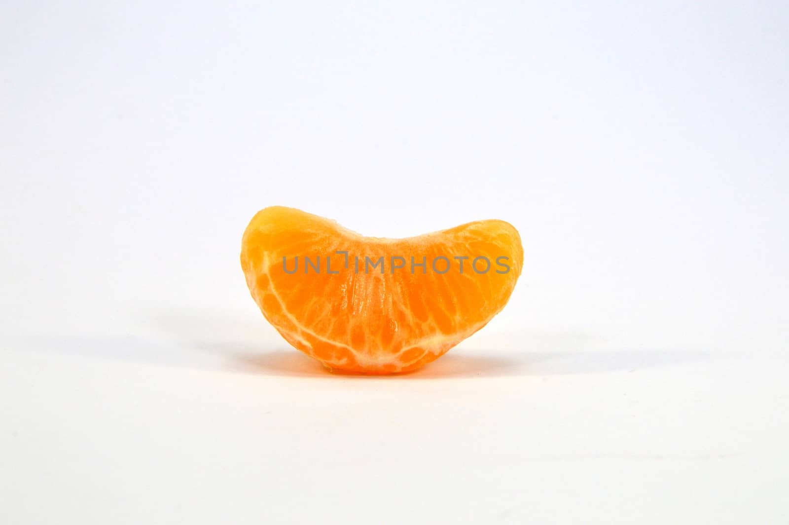 Tangerine parts on a white  by Philou1000