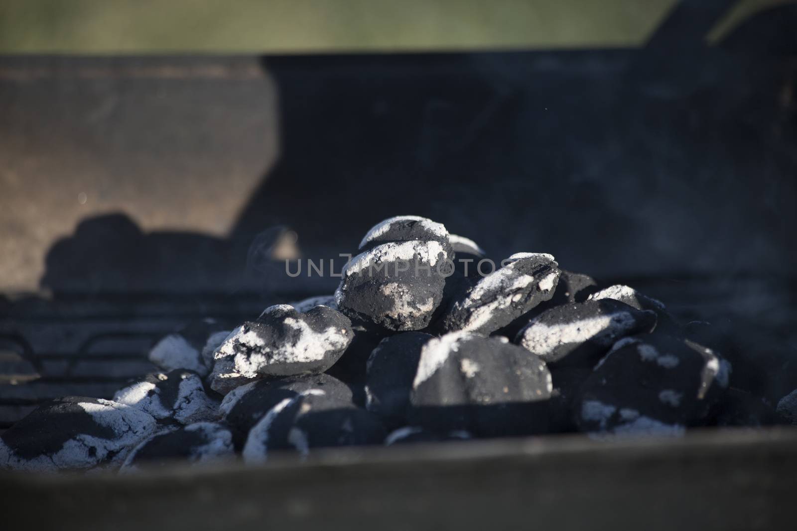 Smoking charcoal with small flame